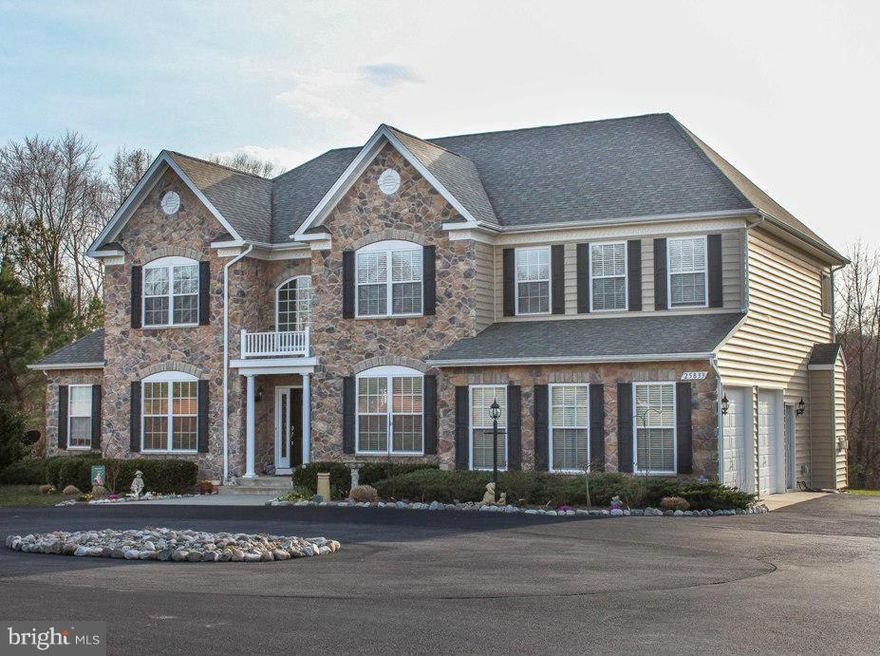 This beautiful home shows like a model. The spacious floorplan features a side sunroom and morning room 4 large bedrooms upstairs and a sitting room off of the master bedroom. The Master bedroom retreat is huge, and the Spa Bath is so luxurious. glass block wall in the shower and corner tub. This large 4.5 acre lot allows for lots of room to relax indoors and out. This home is priced to sell!