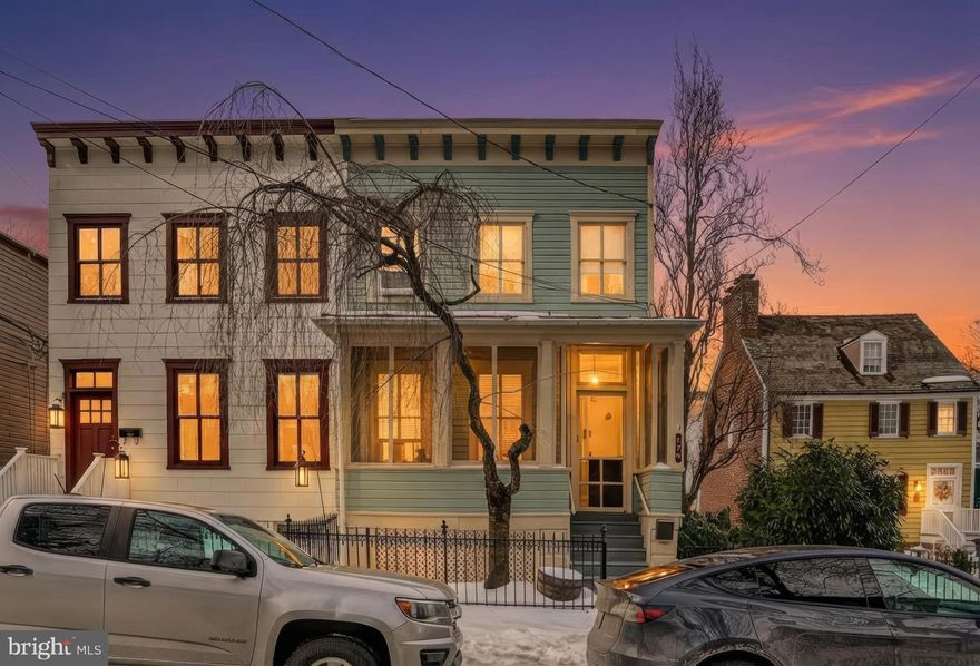 Welcome to the heart of downtown Annapolis at 179 Green Street. This charming home blends timeless character with modern comfort, this is just a block from Main Street and City Dock, few block from the Naval Academy, State Capitol building, boutique shopping, and Annapolis Elementary School. Located in one of the city’s most desirable neighborhoods, it offers exceptional walkability and vibrant city living. The main level features inviting front and enclosed side porches—perfect for morning coffee or unwinding with a glass of wine in the evening. Inside, wide-board pine floors lead to an L-shaped kitchen with bright white cabinetry, stainless steel appliances, and a convenient stackable washer and dryer nearby. The living room showcases rich wood wainscoting, detailed wood trim, custom built-in bookcases, and a rustic fireplace accent, creating a warm and cozy atmosphere. A dedicated dining room completes the main level, ideal for everyday living and entertaining. Upstairs, the home offers two spacious bedrooms and there is n extra versatile space featuring an exposed beam ceiling, curved built-in arch shelving, and custom cabinetry—ideal for a home office, or a den. A large bathroom showcases a Victorian-style Van Buren clawfoot tub, adding timeless historic character. Outdoors, the fenced backyard provides a private retreat for entertaining or relaxing. The property also includes two oversized off-street parking spaces, offering exceptional convenience. Step into a lifestyle steeped in history and culture. Wander charming cobblestone streets to acclaimed dining, embrace sailing and local events, and enjoy the dynamic rhythm of downtown living just beyond your doorstep. This is a rare opportunity to own a true piece of Annapolis charm—schedule your private showing today.