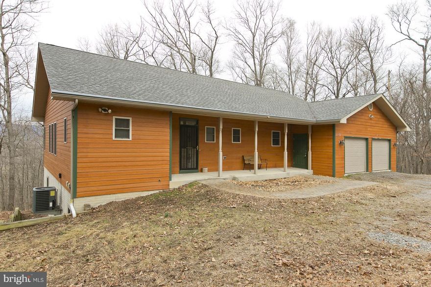 Welcome to "The Retreat".  Custom home built for getting away from it all. 2 screened porches on main and below. Year round comfort with wood stove in finished lower family room and living room w/wood burning FP (2 wooded lots = over 13 acres for lots of firewood). Cul-de-sac private location about 10 miles from I81. Plus low maintenance masonry siding. Have it all here in wild, wonderful WV!