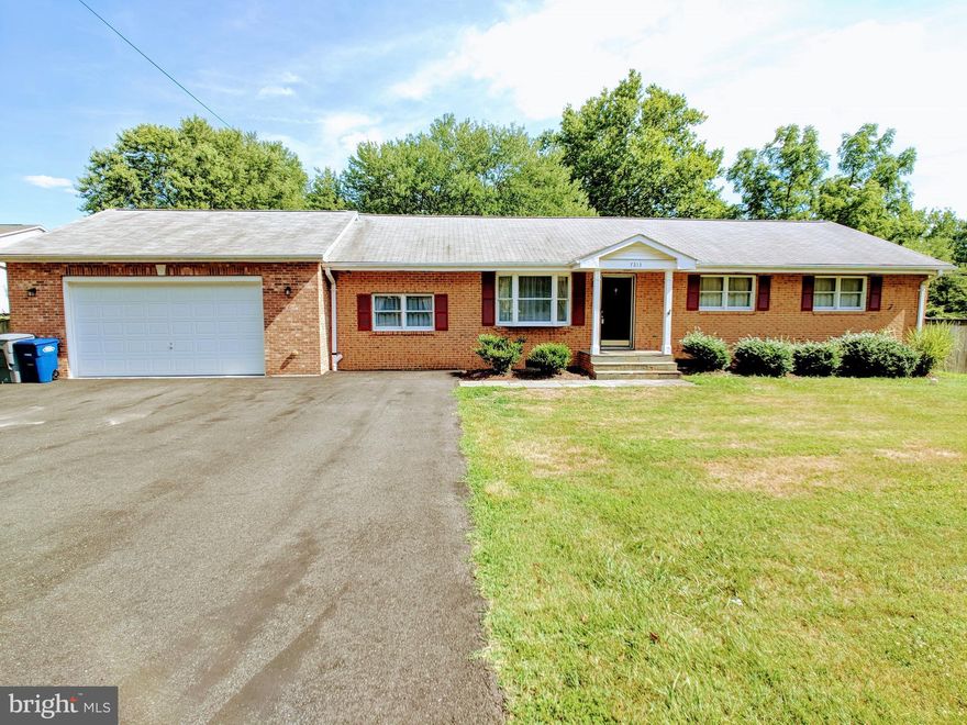 Location! Location! New price!  Solid brick rambler on a beautiful acre lot. Hardwood floors on main level. Remodeled kitchen.  Lot is level and clear.