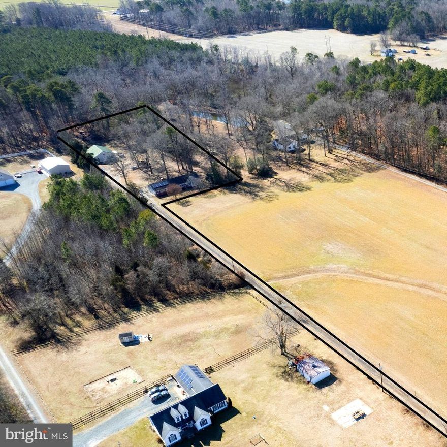 WOW!!! Don't miss this opportunity! Invesment??? Family compound??? Rental properties??? Live in one, rent the other???The possibilities are many! This property boasts not one but 2 houses, and even better on 1.60 acres of land! The main front house has 3 bedrooms and 2 full baths, and a nice size garage, with floored attic storage above. Lux vinyl flooring throughout most of the house. Enjoy the pastoral views from your living area and even a nice back deck to enjoy the warmer months. The back house has 4 bedrooms and 1 full bath. You will enjoy the open floor plan of this home. The living room has a nice gas burning fireplace for those cozy winter nights, and a fully fenced back yard for the whole family to enjoy.  The properties share a well, but each have their own septic systems. An opportunity like this won't last l long. You can live in one and have the rental income of the other house, rent them both or even have your own family compound. The possibilities are endless. All within the amenities of the town of Denton right outside your door.