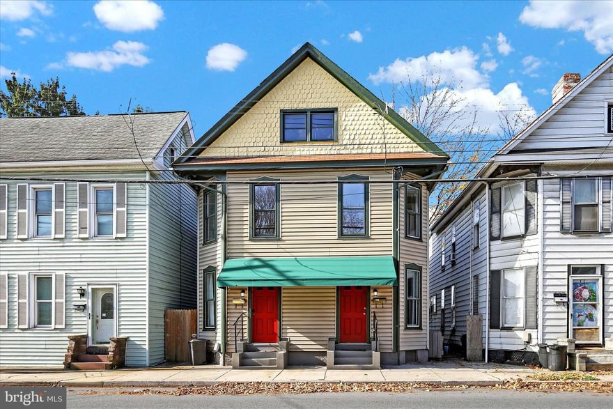 Welcome to this charming semi-detached home situated on a spacious lot in the heart of Chambersburg Borough! This home combines character with modern updates, featuring updated kitchen and baths, new luxury vinyl plank flooring and fresh paint throughout! Step inside to the living room that flows into the formal dining area, ideal for hosting family and friends. The kitchen features ample cabinet space and stainless-steel appliances, while a convenient mudroom adds functionality. Upstairs you'll find three cozy bedrooms and a full bath. The unfinished basement and walk-up attic offer plenty of storage options. Make your way outside to the cleared and partially fenced backyard, perfect for outdoor enjoyment. Off-street parking is available in the back. Enjoy easy access to the playground across the street as well as nearby shopping, dining and entertainment. Recent upgrades include a newer HVAC system and gas furnace. The adjoining side at 509 S 2nd St is also available for sale, with estimated rental income of $1,200/month per unit. Seller is related to agent.  A joy to own!