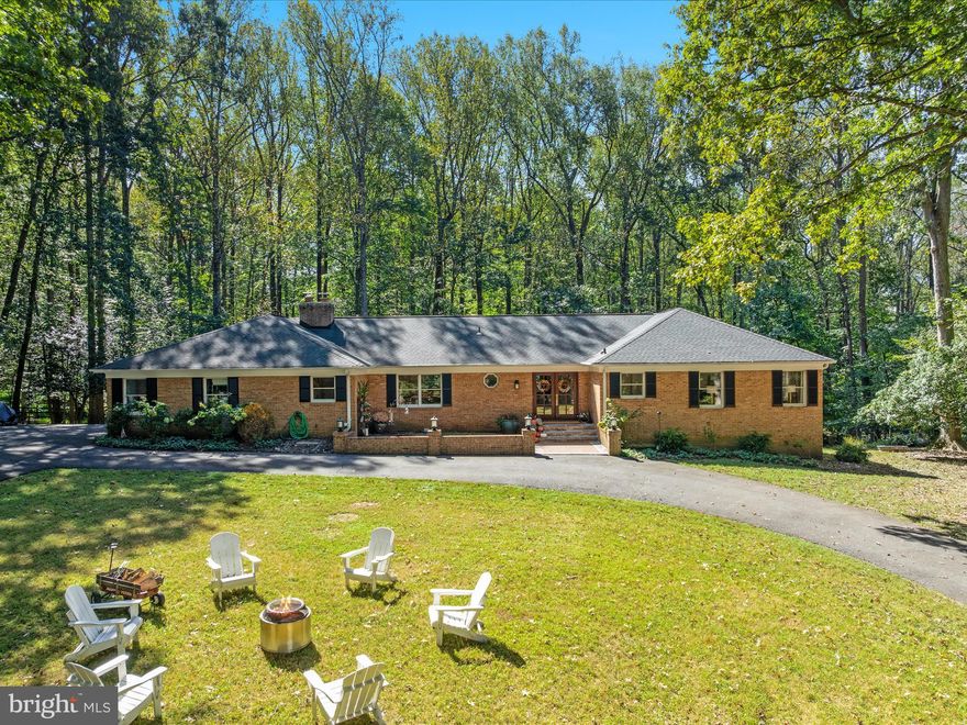 Welcome H O M E! This beautiful private wooded estate begins with a winding drive and offers coveted main-level living on 5 picturesque acres! The elegant four-side brick construction features 5 bedrooms, 3.5 baths, and over 5000 finished square feet of inviting living space. Enjoy morning coffee on the rear deck, a refreshing dip in the outdoor pool, or fall fire pits under the night sky!  A classic double-door entry opens to a rich, traditional living room filled with natural light.  You’ll find walls of windows, hardwood floors, and Hunt Country character throughout.  The modern kitchen renovation impresses with quartz countertops, gas cooking, and stainless steel appliances.  The spacious family room is anchored by wood-beam accents and a brick surround fireplace - creating a warm and comfortable gathering space. The primary suite offers a walk-in closet and a spa inspired bath with dual sinks. Three additional bedrooms complete the main.  Retreat to the lower level, where you’ll discover an additional bedroom and full bath, three versatile sitting areas, a convenient kitchenette, and ample storage.  The lower level also features a walkout exit, fresh neutral paint, and durable luxury vinyl plank floors. There are so many thoughtful details throughout — including two wood burning fireplaces, custom built-ins, spacious mudroom, and chickens!<br><br>Experience the lifestyle, the privacy, and the timeless charm of this one-of-a-kind estate!<br><br>New roof (2019), new front door (2023), new well pump(2022), new water treatment system(2023), new heating/cooling (2022/2023), new pool motor/cover(2019), and new pool pump(2021).  All dates are approximate.<br><br>LOCATION LOCATION LOCATION!  This exclusive Tally Ho Equestrian community offers all residents a community riding ring, barn, and pond!  All of this while M I N U T E S to Tysons Corner, Metro, Capital One Hall, Wolf Trap Center for Performing Arts, Great Falls National Park, Reston Town Center, Dulles International Airport, Washington & Old Dominion Trail, Cross County Connector Trail (CCT), Seneca Trail system, and downtown Great Falls grocery, dining, and community events! Elite schools.  Easy access to Route 7, Toll Rd, 495.