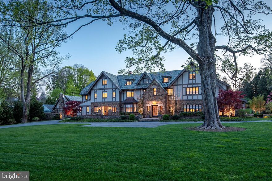 With breathtaking views of the 15th fairway of the famed Merion Golf Club, this stately English Tudor has recently been renovated, expanded and is exquisite inside and out.  Positioned on 2.24 acres, its stone walls and lit entrance piers at both Golf House and Andover Roads welcome you home.  The property comprises a grand main residence with 6 bedrooms, 5 full baths and 3 powder rooms, and separate carriage house with a 5-car heated garage and 2-bedroom apartment above. On the sprawling estate grounds you’ll enjoy a sparkling pool with spa; flagstone patios for entertaining; and a new pool house with stone exterior, covered patio, masonry fireplace, full kitchen with bar counter, laundry and full bath.  Every inch of this jewel was considered by the owners in its no-expense-spared renovation and expansion. Thoughtful enhancements include an added parking area; rebuilt front veranda; extensive landscaping & exterior lighting; new and refinished windows; new custom French doors; refurbished slate roof; rebuilt chimney with new liners; new entry columns; and new copper roof & gutters on the family room and side entrance additions. All systems and mechanicals are also top of the line, from new plumbing and electrical to high-efficiency Geothermal HVAC; new hot water heaters; and an Elan smart system in the main and pool house for interior/exterior lighting, music & media controls.  Plus a new 38K BTU Kohler generator is on standby to power the entire main residence and garage doors in the event of an electrical outage. Gracious interiors received the same attention to detail and offer every luxury amenity. Among them is a new elevator accessing 3 levels; all new recessed lighting controlled by Lutron Home System; radiant heat flooring in the entry foyer, rear hall, family room and master bath; and a stunning new custom chef’s kitchen with Waterworks cabinetry, a huge island, custom hood/ventilation system, and full suite of premium Gaggeneau, Sub-Zero & Miele professional appliances. Elegant remodeling continues in the generous living and dining rooms with fireplaces, bedrooms and baths, laundry room, home command center, and entire 3rd level play area which includes two full baths, and two bedrooms, one with three cabin-style platform beds for the kids. The breakfast room, gourmet kitchen and adjacent vaulted family room offers custom windows on three exposures and an easy indoor-outdoor flow through glass doors. A handsome library with fireplace flanked by built-in cabinetry provides a perfect place to read, relax and work. Well-proportioned bedrooms await upstairs for family and guests. The highlight is the luxurious primary suite with a spacious dressing room, custom closets, and spa bath with his/her vanities, a freestanding soaking tub, oversized shower, and water closet. The lower-level extends the living with a large-screen media room with beamed ceilings and gas fireplace, and cards/game area with full bar. Incomparable views of the renowned Merion Golf Club, and a prestigious address near all conveniences heighten the allure.