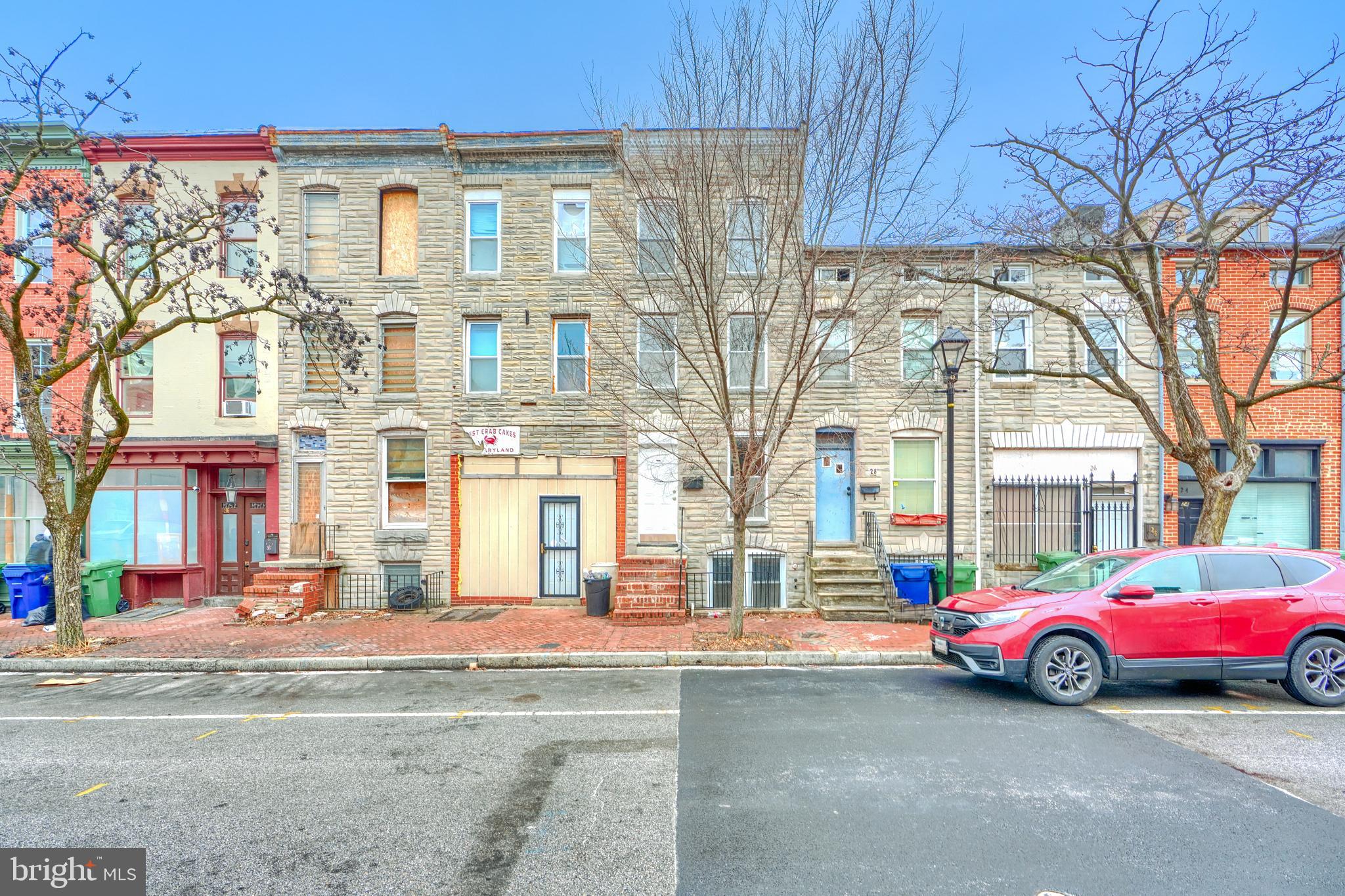 Just reduced! Located in the heart of the revitalized Hollins Market neighborhood, this charming three-bedroom, two-bath home is move-in ready and waiting for its next owner. With the historic Hollins Market newly reopened and the area experiencing an exciting rejuvenation, now is the perfect time to call this neighborhood home. Inside, you'll find fresh updates, including new paint and carpet, creating a bright and inviting atmosphere. The spacious layout features a full basement for extra storage or potential living space. Step outside to enjoy the rear deck and fenced yard, perfect for entertaining or relaxing in your own private outdoor oasis. Don’t miss this opportunity to be part of one of Baltimore City’s most exciting up-and-coming areas!