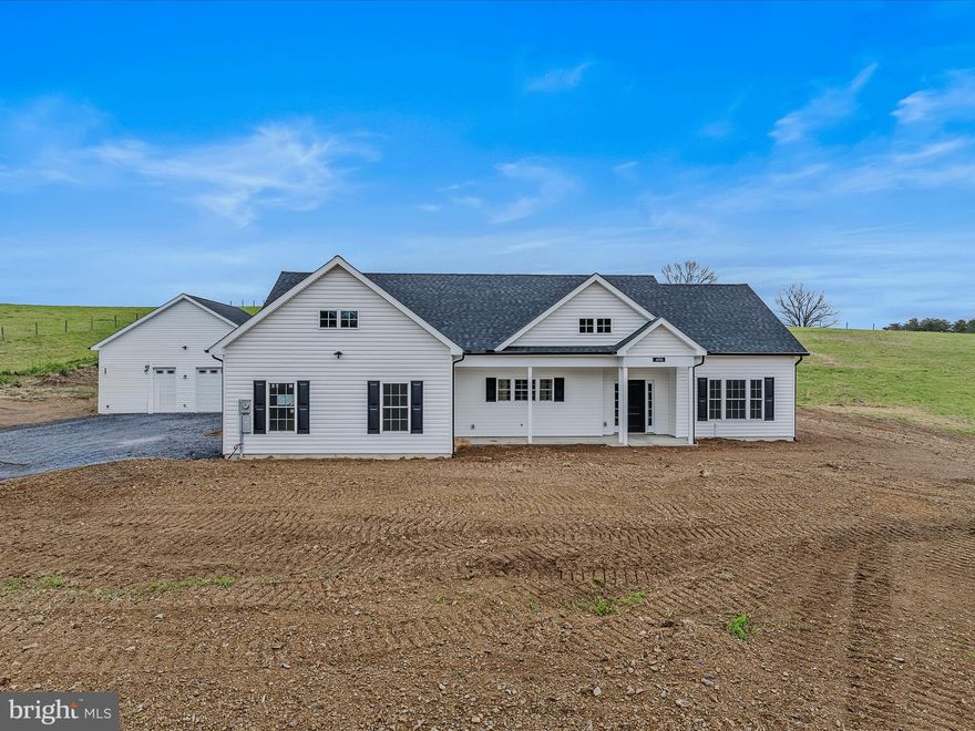 Brand NEW!!! 100% finished and ready for the new owner.  Check out this beautiful almost 1,800 square ft rancher with 2 car attached garage for your cars and an oversized 30 x 30 detached garage for your toys. House sits on a gorgeous 5 acre piece of land. Beautifully appointed with LVP flooring throughout main living areas and primary bedroom.  Carpet in 2nd and 3rd bedrooms.  Gourmet kitchen with large 6 ft island with granite countertops and Whirlpool stainless steel appliances.  This house was built with 9 ft ceilings so from the moment you hit the front door it has a wow factor you will love.  Especially the open concept with large living area and gourmet kitchen.  And off the rear you have covered concrete porch that will allow you to enjoy the peace and serenity of the country setting.