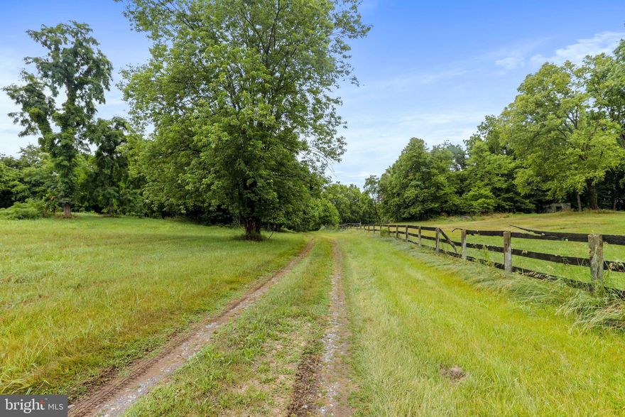 Beautiful Farm Property just minutes from Charles Town on the way to Berryville, VA along Route 340.  Property has a barn large enough for 16 horses, a riding ring, multiple fenced paddocks, run in sheds, and more.  Fences need some work, but property would make a GREAT homestead!  Property cannot be subdivided without a variance from Jefferson County as per planning commission.  Easement for driveway is 40 ft.