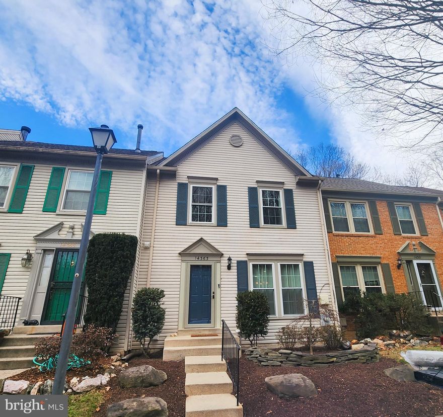 Stunning 3BR townhome located near the end of a quiet Long Channel cul-de-sac, backing to serene woods and the lake. Enjoy direct access to a walking path that leads straight to the water.

This spacious home features hardwood floors on the main level and brand-new carpet in the upper-level bedrooms. This modern kitchen has been completely remodeled with designer custom cabinetry, quartz countertops, and stainless-steel appliances, flowing seamlessly into a large, dining area.

The expansive living room opens to a deck with partial lake views and is complemented by designer paint throughout the home. The upper level offers vaulted ceilings and an updated primary bathroom with double-vanity sinks, a separate shower, and fresh finishes.

The lower level includes a spacious family room with a fireplace, powder room, and walk-out patio, perfect for relaxing or entertaining. Additional highlights include a large utility room with an added workshop and abundant storage space throughout.
Close to major commuter routes!