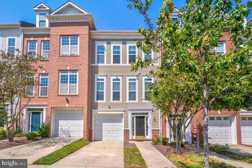 Welcome to 5420 Hartfield Avenue, an impeccably maintained and beautifully upgraded 
townhome located in the highly desirable Town Homes at Camp Springs Community at the 
Branch Avenue Metro.  Perfectly blending style, comfort and modern amenities, this light-filled 3 bedroom, 3.5 bath garage townhome offers soaring ceilings, gleaming Bamboo flooring throughout the main living area, staircases and landings, and over 2640 square feet of living space on three finished levels.  Entrance to this home is through the entry foyer on the lower level which leads  to a dual staircase where you can ascend to the main level or descend to the lower level of this home.  The main level offers an open floorplan and is comprised of the living and dining areas, the eat-in kitchen and a convenient powder room.  The chef’s kitchen is truly the heart of this home as it can easily accommodate a large gathering table or a cozy seating arrangement, and is enhanced by dark cherry 36” cabinets, granite countertops, upgraded black appliances -- cooktop with downdraft, French Door refrigerator with icemaker (2025), built-in microwave, dishwasher, double sinks, garbage disposal -- a large prep island with storage, pantry, and access to the 20x13 maintenance-free composite deck.  This outdoor living pace overlooks trees with serene views of the retention pond providing the perfect setting for outdoor entertaining, morning coffees or evening meals.  Upstairs, relax in the spacious primary bedroom suite which 
boasts a large walk-in closet, an ensuite bathroom with double sinks, soaking tub and separate shower.  Bedrooms 2 and 3, another full bath with tub/shower, and the laundry closet complete this level.  Last, but not least, is the fully finished lower level with a well-proportioned family room with a gas fireplace with remote and outside access to the 20x14 brick patio, a third full bath, the utility closet which contains the hot water heater (2022), HVAC system with humidifier/air purifier (2020), and the 
water purification system (2024).  The one-car garage is fitted with overhead storage bins and an EV charger.  This home has been freshly painted, the roof was replaced in 2024, new ceiling fans installed in Bedroom 3 and the family room in 2025.  The 4-mounted flat screen TVs in the living room, kitchen, family room and primary bedroom will convey with the home.  This home provides numerous SMART features, to include the NEST programmable thermostat, the Ring Doorbell with 2 mounted Arlo security cameras and 1 additional camera, the MyQ Garage Door Sensor, and the LifX Wi-fi enabled lighting 
system/light bulbs, all of which are controlled via app from your Smartphone or tablet.  The SimpliSafe Security System ($33.91 monthly) includes 24/7 live security agents and 2 alarm remotes.   Take advantage of the many amenities available in this community which include a community clubhouse with controlled access which offers a wi-fi center, media center, conference room, entertainment kitchen, fitness center, indoor basketball/sports court, tennis courts, picnic/grilling area, pool/sun deck, and kids’ playground.  The clubhouse and amenities are operated by MetroPlace and membership is available at a fee.  This community also offers retail and dining options at Restaurant Row.  Say farewell to long commutes as this home is ideally located within a 4-minute drive/10-minute walk to the Green Line Branch Avenue Metro Rail, as well as easy access to Joint Base Andrews, Joint Base Anacostia-Bolling, the National Harbor, Washington, DC and all major commuting routes.  This home is truly turkey and ready for immediate occupancy, so don't miss out!