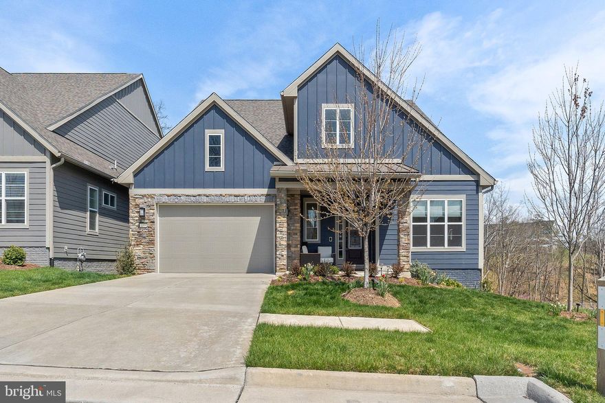 Welcome to effortless elegance and everyday comfort in this beautifully upgraded Craftsman-style home in the 55+ gated community of Lake Frederick. Perfectly positioned on a private corner lot backing to mature trees, this home offers over 3,100 square feet of refined living space and more than $265,000 in premium designer upgrades.<br><br>
Inside, wide-plank white oak hardwood floors diagonally laid, designer light fixtures & fans, custom window treatments, and an open, light-filled layout set the tone for relaxed luxury. The Signature Kitchen impresses with floor-to-ceiling cabinetry, under-cabinet lighting, and high-end finishes. A sun-drenched sitting room and private covered deck invite you to unwind with peaceful wooded views.<br><br>
Downstairs, a finished lower level adds flexibility for hobbies, guests, or game nights, with spacious storage rooms. The spa-like primary suite features a walk-in glass shower, dual vanities, and elegant tilework.
This Smart Home is fully outfitted for worry-free living with keyless entry, whole-house humidifier, air cleaner, water softener and de-chlorination system, extended garage, extra insulation, in-ground irrigation system, and battery backup sump pump. Full lawn care is included in the HOA—just lock the door and go. This is truly lock-and-leave living done right.<br><br>
More than just a beautiful home, Lake Frederick is a vibrant lifestyle. Residents enjoy resort-style amenities & clubs including indoor and outdoor pools, tennis, pickleball, a state-of-the-art fitness center, dog park, and over 8 miles of scenic trails. Meet friends at the clubhouse or enjoy a sunset dinner at Region’s 117, the community’s lakeside farm-to-table restaurant. With the Blue Ridge Mountains as your backdrop and easy access to I-66, I-81, and nearby attractions like Skyline Drive and Shenandoah National Park, adventure is always within reach.