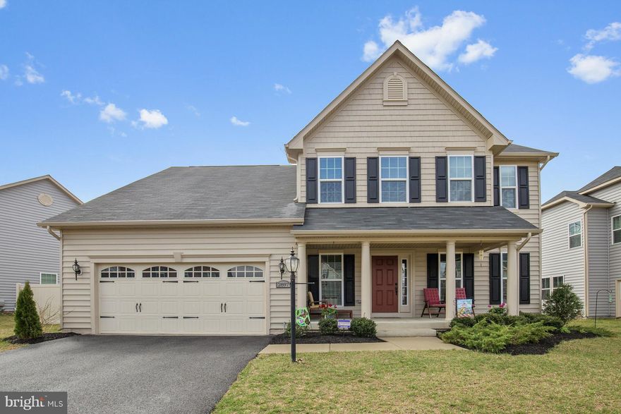 Numerous amenities - hardwood flrs on main lvl, stainless steel appliances, maple cabinets, stone fireplace, & granite counters in kitchen. Bright morning room off kitchen, separate dining rm. Bright bdrms w/ceiling fans. Master suite w/en suite double vanity bath & walk in closet. Finished basement rec room with wet bar.  Lots of storage. Fenced backyard backing to woods. 2 car garage & more!