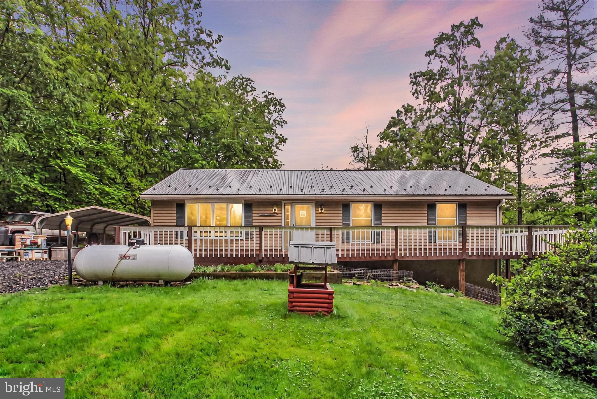 PRIVACY AT ITS BEST! one 1 ACRE, this 3BR, 2 BA Rancher, with its NEW METAL ROOF 2024, has a wonderful mountain view to be seen from the wrap around deck that is an entertainer's delight. This porch/deck combo wraps around three sides of the home and is extremely spacious. There's plenty of cleared area and some wooded area to enjoy the great outdoors. Likewise, the rooms inside are pretty good size for a ranch style home and have lots of natural lighting. The basement has been semi-finished, ceiling is high; ideal space for a game room. The unfinished portion of the basement houses the utilities, is heated and cooled, and affords excellent storage; also serves as a workshop! Basement does have a level walk out to the yard. Home located near Michaux State Forest and its various hiking trails. Seller is in the process of painting the floor of the deck right now. Drive Bys not encouraged to respect the privacy of all residents along these private roads. Professional photos to be available as we get closer to the Expected On Market Date, which may be adjusted. Plan for your showing and get on the schedule now!