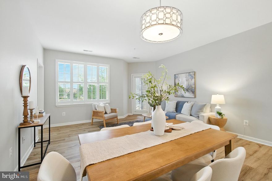 Stunning 1BR+Den condominium in the 55+ Village at Waugh Chapel - fantastic garage parking space included! Bright, welcoming, and move-in ready, this home has been enhanced with new luxury vinyl flooring, upgraded countertops, stainless steel appliances, neutral paint, and plantation shutters. You'll adore the spacious primary bedroom, featuring a sitting area, en-suite bath, walk-in closet, and access to a private balcony. The office can also serve as a second bedroom when needed! The main living space is open to the kitchen, making it perfect for entertaining, with bar seating and ample space for both a dining area and living room. The vibrant Village West at Waugh Chapel community is always hosting something fun, from book club and game day to movie nights. Enjoy a clubhouse, gym, and walking trails around the lake right in your neighborhood. Nearby shopping centers are easily accessible on foot and offer convenient options for grocery stores, shopping, dining, salons, and more. Welcome home!