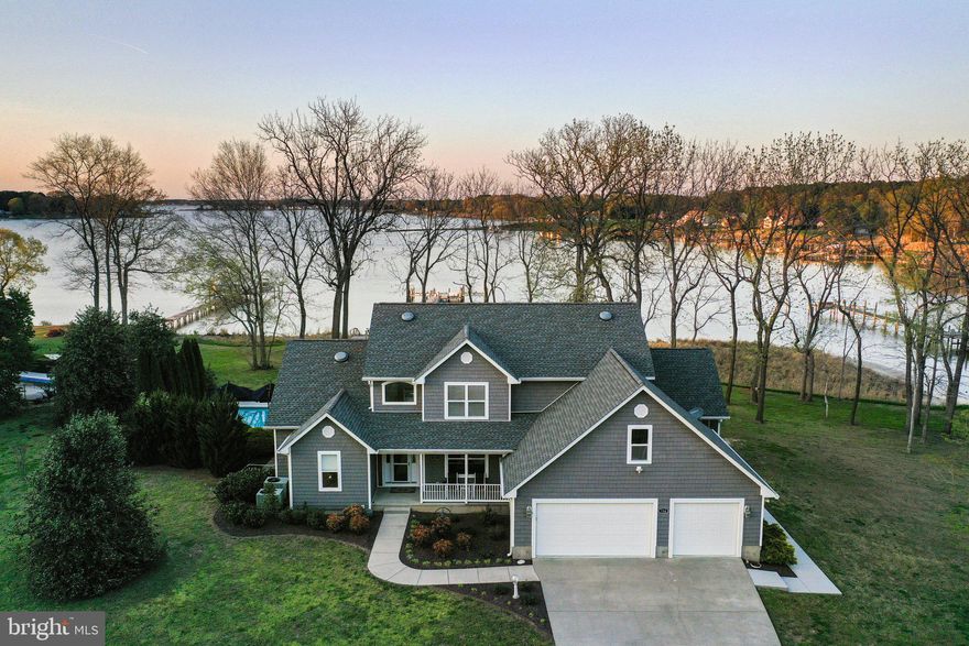 ​Experience unparalleled waterfront living in this exquisite 4-bedroom, 3.5-bathroom coastal retreat nestled along Lower Machodoc Creek in Virginia's Northern Neck. Designed for both relaxation and grand entertaining, this home seamlessly blends luxury with the natural beauty of its surroundings.​
Upon entering, you're greeted by expansive floor-to-ceiling glass windows that flood the open-concept living and dining areas with natural light, offering uninterrupted vistas of the serene creek. The updated gourmet kitchen, a chef's delight, boasts state-of-the-art appliances and custom cabinetry, flowing effortlessly into both indoor and outdoor dining spaces.​ The first-floor primary suite serves as a private sanctuary, featuring panoramic water views. Upstairs, three additional bedrooms and two full bathrooms provide ample space for family and guests, each thoughtfully designed with comfort in mind.​ Outdoor amenities abound, including a spacious screened porch perfect for morning coffees or evening sunsets. Durable composite decking extends throughout, leading to a private dock equipped with composite decking, and multiple boat lifts (10,000 lb and 20,000 lb), facilitating effortless access to the creek and the Potomac River. The inviting saltwater pool features a heater and chiller for added enjoyment, while the fully equipped stacked stone outdoor kitchen and bar elevates alfresco dining experiences.​ Completing this remarkable property is a generous three-car garage, offering ample space for vehicles and storage. Situated in the heart of the Northern Neck, this stunning home  is located in a peaceful neighborhood on one of the most popular creeks in the area, providing quick and easy boating access to the Potomac River, making this location perfect for water lovers. Don't miss the opportunity to own this coastal haven where every detail is crafted for comfort and elegance.