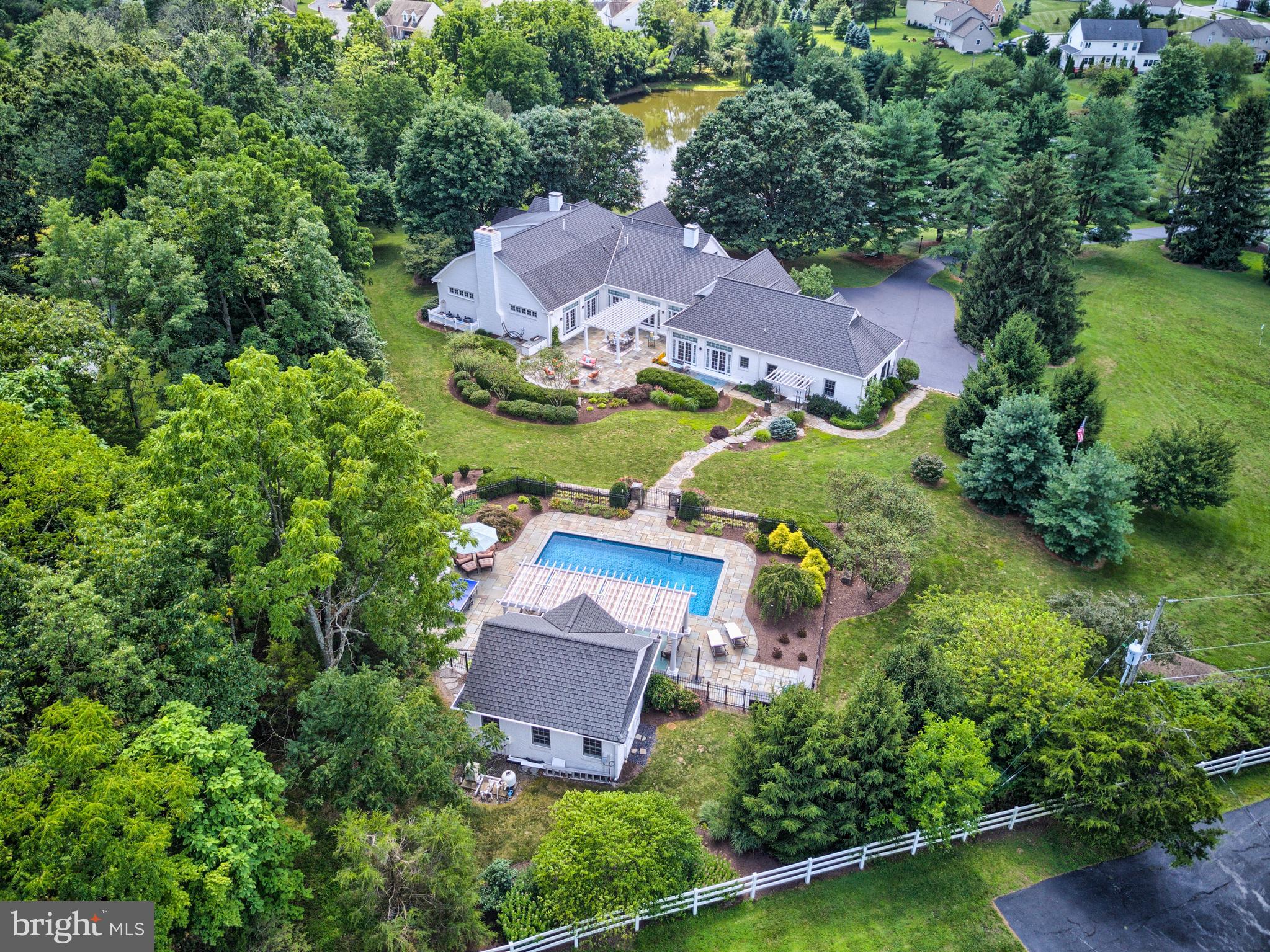 This stunning Gettysburg estate offers luxury touches through every area of this impressive property. Open and a light-filled floor plan that highlights the gleaming oak hardwood floors throughout. The generously sized main level master suite, complete with a large walk-in closet and stunning marble bath. The spacious gourmet kitchen is a dream come true for those who appreciate cooking, complete with granite countertops, top-of-the-line appliances, subzero refrigerator/ freezer and so much more. Relax on your breathtaking bluestone patios and entertaining area or enjoy the inviting saltwater pool with pool house. The grounds are scenic and peaceful with over 7 aces to enjoy, including your very own 1-acre pond. Must see the home in person to appreciate all that it offers its new owners.