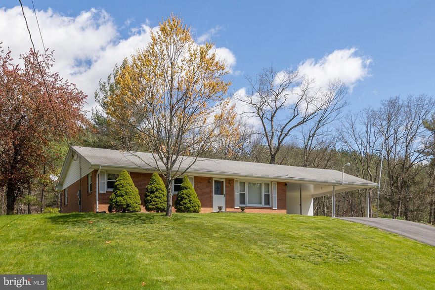 BUILT TO LAST A LIFETIME.....IMMACULATE BRICK RANCHER FROM AN ERA WHEN HOMES WERE BUILT STRONG AND PRIDE OF OWNERSHIP WAS PARAMOUNT. PERCHED ON A KNOLL OFFERING GREAT VIEWS OF NORTH RIVER MOUNTAIN AND FRONTING ON A QUIET PAVED COUNTRY ROAD, THE SETTING IS WHAT WV LIVING IS ALL ABOUT.....LUSH GREEN LAWN IN THE FRONT AND SEASONAL STREAM IN THE BACK, 1.27 UNRESTRICTED ACRES BUT IT FEELS BIGGER. BUILT IN 1964 BUT IT DOESN'T SHOW IT'S AGE A BIT, IT'S EVIDENT THIS HOME HAS BEEN WELL CARED FOR. ORIGINAL HARDWOOD FLOORS IN BEDROOMS & ORIGINAL KITCHEN CABINETS LOOK BRAND NEW, PERGO FLOORING IN LIVING ROOM AND VINYL REPLACEMENT WINDOWS. THE UPSTAIRS BATHROOM WILL BE BACK IN STYLE BEFORE YOU KNOW IT! PAVED DRIVEWAY AND MASSIVE CARPORT WITH STORAGE ROOM. THE BASEMENT IS PRACTICALLY FULLY FINISHED WITH A BED AND A BATH....4 BED, 2 BATH TOTAL. STAY CONNECTED WITH JUST INSTALLED FRONTIER FIBER INTERNET! YOU'RE GETTING YOUR MONIES WORTH WITH THIS HOME.....AN IMMACULATE BRICK HOME WITH OVER 2400 SQ FT OF FINISHED SPACE, ON A BEAUTIFUL LOT IN A CONVENIENT COUNTRY LOCATION. NOT SURE WHAT MORE YOU COULD ASK FOR....