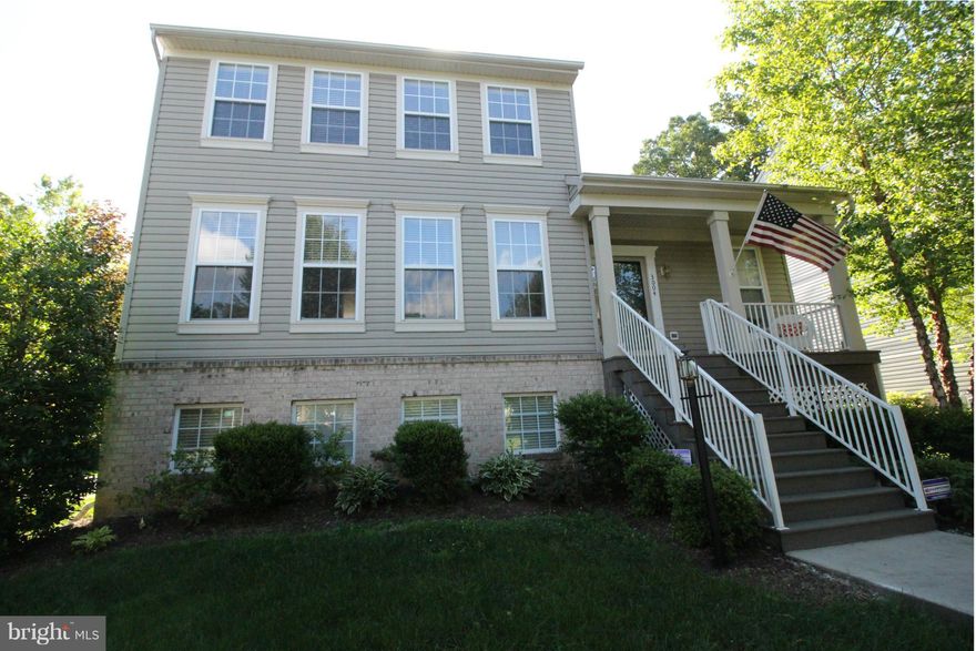 Bright and Sunny Colonial in Desirable Terra Maria. Home features an adorable front porch, beautiful hardwood floors, gourmet kitchen, granite counters, ss appliances, gas fireplace, open floor-plan, large bedrooms, master bedroom suite with walk in closet, lower level rec room with glider to outside, rough-in for 1/2 bath, large back deck and 2 car garage.  Community tennis courts and clubhouse.