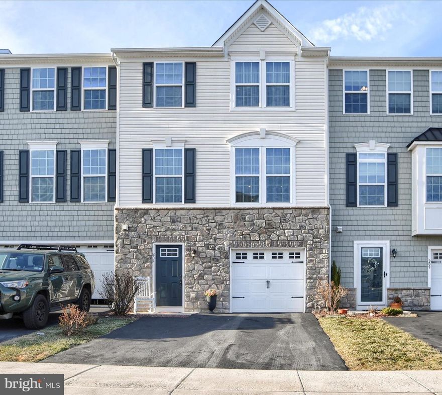 Welcome to 207 Laurel Lane! This 3 story townhome, located in Perkasie Borough, has been meticulously maintained and is ready for its next owner. Enter the lower level through the front door or through the attached garage, into the bright foyer, perfect for greeting guests. Completing this floor is a spacious recreation room with a gas fireplace that leads out to the back patio, which has a waterproofed roof, and a half bath. Taking the stairs to the main floor, the open floor plan will show a sizable dining area, a kitchen featuring stainless steel appliances and an island great for hosting, and a living room. Out back is a deck overlooking Lenape Park, where you can enjoy events such as fireworks and live music from the comfort of your own home. On the third floor you will find the primary suite, completed by a walk-in closet with plenty of shelving to hang or store items, and an ensuite bath with a large tub, walk-in shower and dual vanity. This floor holds 2 additional bedrooms, another full bathroom, and conveniently located upper floor laundry. Community amenities include tot lots and playgrounds, and lawn maintenance, snow removal and trash is covered by the association fees. Located minutes from the heart of Perkasie Borough, this home is not to be missed!