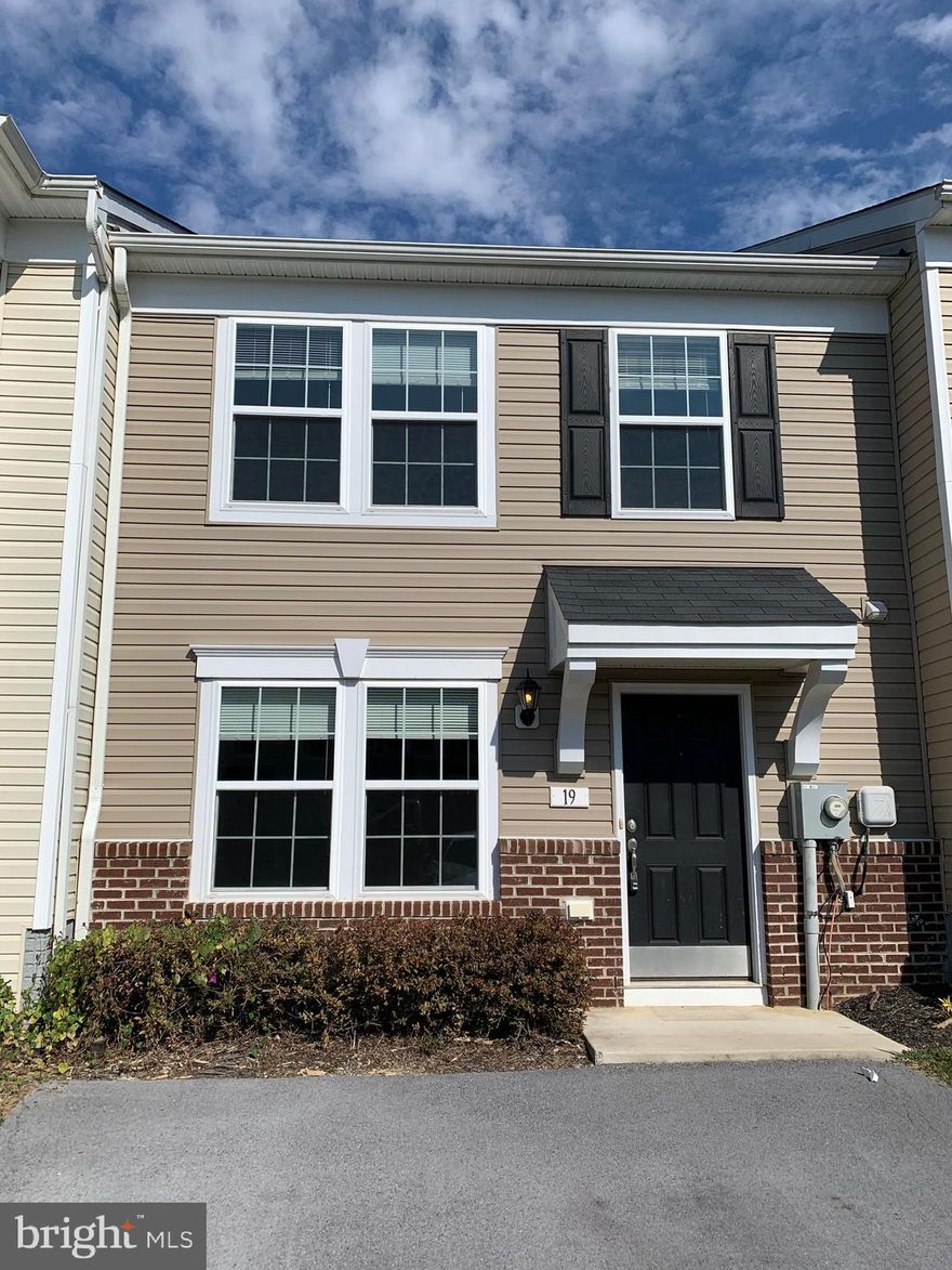 Three bedroom, two and half bath townhome ready for occupancy!  Offers main level entrance, and laminate flooring throughout!  Fully equipped eat-in kitchen w/ additional bump-out space w sliding doors open to rear fenced yard and connected exterior storage room. Master bedroom w/ full bathroom and walk-in closet offers the additional bump-out space. Bedroom level laundry area w/ washer/dryer. Located minutes from I-81 for the MD commuter.