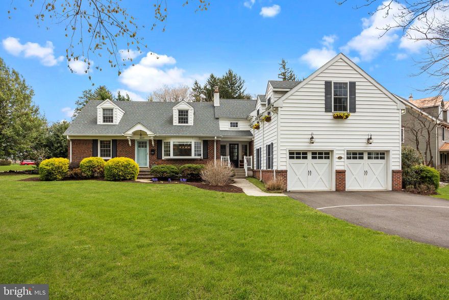 Don't miss this expanded Cape Cod style home, brimming with charm, and offering an abundance of space to accommodate today’s lifestyle. Perfectly situated in Historic Newtown Borough, this residence is just a short stroll from quaint boutiques, acclaimed restaurants, the wonderful Newtown Theatre and community parks. 
Sunlight pours through every window, highlighting the rich hardwood floors and showcasing lovely views of mature trees and vibrant gardens. At the heart of the home lies the thoughtfully updated kitchen featuring custom white cabinetry, elegant soapstone countertops and farm sink, stainless steel appliances, and stylish pendant lighting. Just off the kitchen, the inviting family room is anchored by a cozy gas fireplace flanked by a wood mantle, and custom built-in shelving to display your books, art and cherished keepsakes. The spacious dining room, enhanced by a wide bay window, provides a perfect setting for gatherings both large and small.
A convenient main floor bedroom, with a generous walk-in closet, is adjacent to a full bath—an ideal space for guests or multi-generational living. A private home office rounds out this level, offering a quiet retreat for remote work or creative pursuits. A spacious two car garage, accessed via the mudroom, offers plenty of room for outdoor gear and equipment.
On the second level, the expansive primary suite features a walk-in closet and beautifully updated en-suite boasting luxurious custom tile finishes, a large walk-in shower and dual-sink vanity. Three additional well-proportioned bedrooms and hall bath are included on this level, in addition to a dedicated laundry room and charming alcoves offering flexible space for reading, workouts, and hobbies. 
The partially finished lower level is designed for fun and function, offering spaces for, media, music, and recreation, along with a separate area for workshop and storage. Step outside to your private stone patio—perfect for sipping your morning coffee, hosting a summer BBQ, or enjoying lawn games as the sun begins to set. Impeccably maintained and move-in ready, this exceptional home invites you to enjoy the best of Bucks County living in one of its most picturesque towns. Conveniently located close to major highways, train stations, and airports for your next vacation getaway!