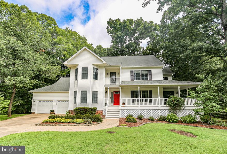 Welcome to this picturesque, established neighborhood filled with beautifully built custom homes on large, lush lots—with no HOA!  Over one acre to do with what you wish. As you enter the community, you’re greeted by a sense of space, maturity, and privacy. Nestled quietly at the end of a cul-de-sac, this home offers exceptional tranquility and seclusion. The house is strikingly handsome and inviting. Step inside to a welcoming main level featuring gorgeous hardwood flooring throughout and generous living spaces. The formal dining room includes double French doors that open to an extra-large wrap front  porch—perfect for entertaining. The updated kitchen offers Corian countertops, a double sink, stainless steel stove and microwave, double oven, maple cabinetry, pantry, and a light-filled eat-in area. The spacious family room features a wood-burning fireplace and sliding glass doors leading to a fully enclosed porch with access to the back deck. A thoughtfully designed floorplan and quality finishes throughout the main level create a warm and inviting atmosphere. Upstairs, the expansive primary suite boasts a three-bay window, walk-in wardrobe, double vanity, and an updated shower/tub combo. Two additional bedrooms, each with classic wood doors and charming details, share an updated full hall bath with a skylight. The fully finished lower level offers incredible flexibility with a massive rec room featuring a floor-to-ceiling brick wood-burning fireplace and mantel, a fourth bedroom with a closet, window, and direct exterior access—ideal for guests or in-laws. You’ll also find a dedicated laundry room with a window and built-in storage, an updated full bathroom, and an additional flex room that could serve as a home office, hobby space, or workout area. Step outside to enjoy the many outdoor living spaces. The oversized front porch is truly the size of an additional room—large enough for a full dining table or lounge setup..Off the family room a large and very tall screened porch with access to the house and large trex deck  that backs to trees for complete privacy, and a handy storage shed. The extra-large two-car garage offers ample storage and workspace. This home offers the perfect blend of space, privacy, and character—just minutes from downtown Fredericksburg, major commuting routes, schools, and parks. A rare opportunity in a no-HOA neighborhood!  Extra nice neighborhood, extra nice house!