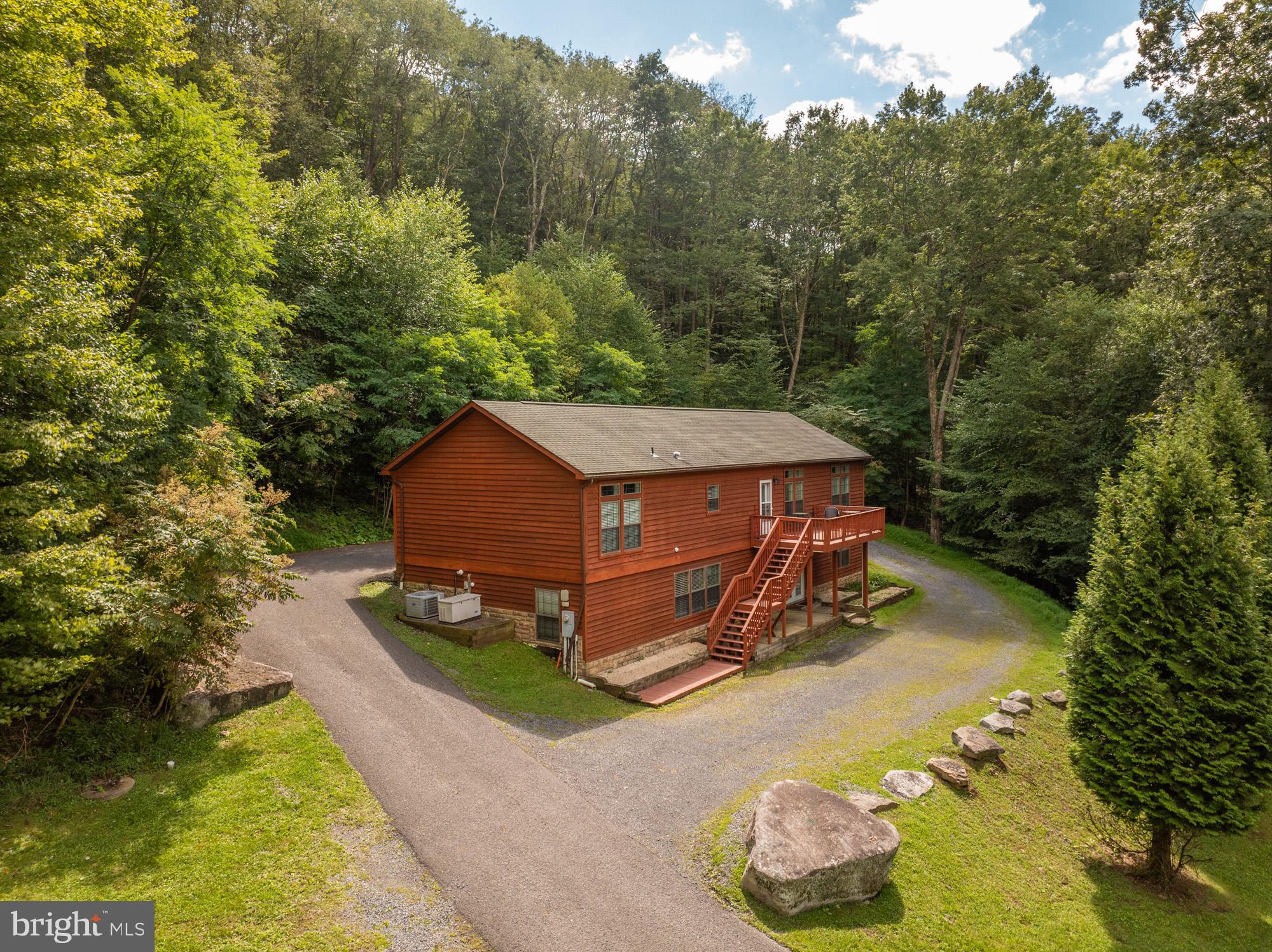 Don’t miss your chance to own this stunning mountain retreat—just minutes from Deep Creek Lake!
Welcome to Hillside Hideaway, a spacious 5-bedroom, 3-bathroom home offering over 3,500 square feet of beautifully maintained living space. Two of the bathrooms have been completely remodeled, and the home features two cozy gas fireplaces and breathtaking views of the surrounding mountains.
The chef’s kitchen is a standout with a gas range, double ovens, an island, and stainless steel appliances—perfect for entertaining. Downstairs, enjoy a large family room complete with a pool table, wet bar, two bedrooms, and a full bath.
Step outside to unwind in the hot tub, gather around the fire pit, and soak in the serene mountain atmosphere.
This home is also a proven rental success with strong reviews—ideal as an investment property or private getaway. Located just minutes from Deep Creek Lake, Wisp Ski Resort, Swallow Falls, Herrington Manor, golf courses, restaurants, and more.
Call today to schedule your private tour!