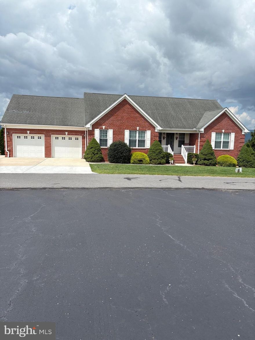 Three bedroom, 2.5 bath house located in a established subdivision overlooking the Town of Moorefield with beautiful panoramic views of the Potomac Valley.  This well built, well maintained home built on a double lot offers many amenities including one level living space with chairlift access to the basement and garage areas.  Laundry centrally located for convenience.  Stainless steel appliances,  natural gas fireplace,  large unfinished basement, double car garage with nice storage area and central vacuuming system.