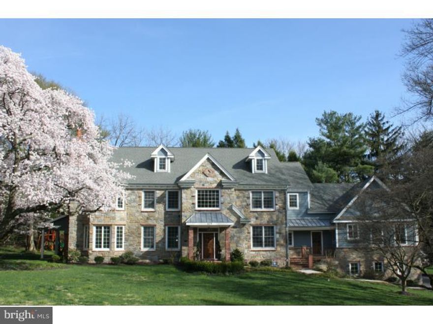 Welcoming two story Center Foyer with richly stained hardwood flrs & traditional turned stair, opens on the right to an elegant formal DR enhanced by 42" paneled wainscoting, deep crown molding & double hung windows which bathe the room in natural light. To the left of Foyer is a Reception Rm with paneled wainscoting & detailed cased openings allowing for seamless transition between this area & the formal & informal spaces beyond. A wide Hall leads to the formal LR with angled window, beautifully milled mantle, wood-burning fp & french door exit to a covered brick Terrace, ideal for entertaining.  Graced by southern exposure is an exceptional home Office with handsome coffered ceiling offering an outside entrance to an expansive deck which connects this room to the fmly & brkfst rooms. Positioned between the Kit  & office is a large, bright Fmly Rm with gas burning fp & full wall windows & french doors, encouraging views of the flat rear yard.  Dramatic custom Kit is highlighted by a volume ceiling, exceptional mill work & an oversized window which faces the rear property. Antique white cabinetry combined with honey colored granite counter tops, hand-formed subway tile backsplash & an impressive Viking appliance package including 6 burner range with double oven & inset griddle, under-counter microwave & 2 dishwashers.  The Brkfst Rm with outside exit is adjacent to the back stair, Mudroom & informal front entry.  Extraordinary first lvl, 2 room In-Law or Guest space with large living space including Kitchenette with dishwasher, full sized sink, granite counters & dark stained cabinetry.  Ascend to a generous 2nd lvl landing & double door entry to the Master Suite, highlighted by a Sitting Area, tray ceiling & his and her closets. A beautifully executed, neutrally tiled stone bath offers under-window soaking tub, separate granite topped vanities & deluxe seated shower with deluge shower heads, hand held shower & multiple body sprays. 3 additional Bdrms on this lvl one with Jack and Jill bath & the other with ensuite bath, all enjoy beautifully detailed finishes including custom millwork work & outfitted closets. A large floored storage area at the end of the hall could be easily finished for a fifth bdrm on this lvl.  Artfully detailed LL with antiqued brick flr, Wine Cellar rm, Powder rm & exit to grade offers generous primary storage & endless expansion possibilities.