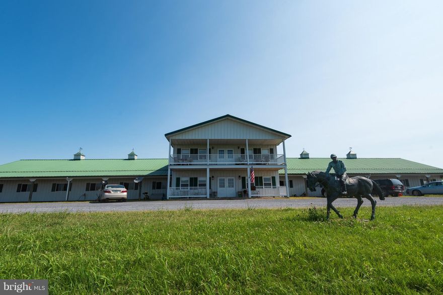 Thoroughbred Equestrian / Horse Training and dressage center close to Charlestown and DC metro tracks. 59 acres with 16 paddocks (with quality built run in sheds and watering systems) , 67 stalls (57 main arena and 10 extra stables nearer to house) ,1/2 mile track and starting gate, 100' X 200' Indoor Arena, Detached Aqua center with pool & wash rooms. Automatic EZ Walker ring and 7 miles 4 board fencing 2 generously sized apartments with stables.Automatic watering systems in 16 field paddocks,  3 wells and hydrants in many locations and in or next to all buildings.   Well designed infrastructure of wells, hydrants, power when originally built. Track with tubular railing fences and starting gate.  Detached 4 BR House with newer windows- private driveway..  Significant road frontage on Highway 340 and across from Post Office, housing development.  Strong potential for future growth.