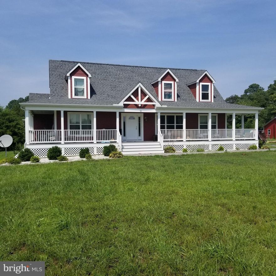 Lovely cape cod home situated on 1.8  country acres with wrap around front porch.   Large first floor master suite with tub and separate tile shower.   Open spacious living area with access to laundry/mud room and another bedroom /den and bath.  Upstairs you will find one large finished bedroom and a large unfinished area plumbed for a full bath and additional bedrooms.  Eco Smart electric hot water on demand.  
Outside is plenty of room for growing your own veggies, run in shed and a large pole building/garage.  
An adjoining lot 1.57 ac  (lot1) is available for $38,000 with the sale of the house.  (perc approved)
Square footage includes unfinished area upstairs.  
Hurry to see this lovely home!