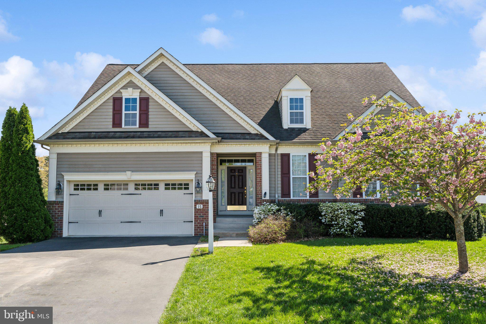 Perfectly situated between Annapolis and Baltimore, offering pastoral views, this spacious residence boasts an open floor plan that seamlessly blends luxury and comfort. As you enter, you are greeted by a grand great room featuring vaulted ceilings and a cozy gas fireplace, perfect for gatherings. The large kitchen, designed for both functionality and style, flows effortlessly into the dining area and an inviting all-season room, allowing for year-round enjoyment of the picturesque view. The main level includes a luxurious primary suite and a second bedroom, both thoughtfully designed for privacy and convenience. You'll also find a full bath, a half bath, and a laundry room, along with access to the two-car garage. Venture upstairs to discover an airy loft that leads to two additional bedrooms and another full bath, providing ample space for family or guests and storage nooks from end to end. The finished basement is a true highlight, featuring a walkout to the backyard, additional bedroom, full bath, wet bar, and a large rec room, ideal for entertaining or relaxing.
Step outside to your private patio, complete with an awning for sunny days and a spacious backyard perfect for outdoor activities. Nestled in a tranquil cul-de-sac, this home offers access to community amenities, including a clubhouse and pool, enhancing your lifestyle. Do not miss the opportunity to make this stunning property your own, where comfort meets convenience in a picturesque setting, retirement has never looked so good! Age Restricted Community