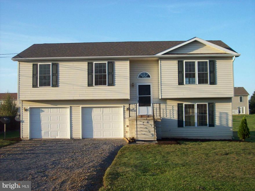 This Spacious Split Foyer SPARKLES!  Only a few years old, &  with Fresh Paint, Flooring, Fixtures, A newly Finished Basement! It Shows Like A BRAND NEW HOME! Great Open Floor Plan with 3Br.& 2 Ba.'s on the Main level with a Master Suite & HUGE Family room on the lower with a 3rd bath rough in. Choice Level/Large yard, 2 Car Garage, & a Rear Deck. Just a skip over the Va. line.. SUPER LOCATION!