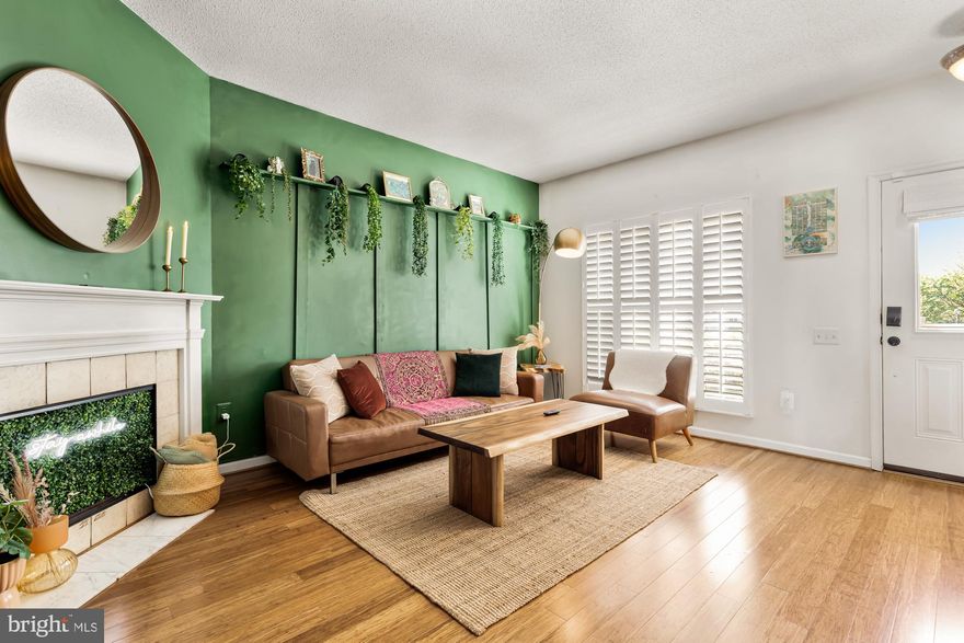 This beautifully designed end-unit townhome features two bedrooms and 1.5 baths, making it an ideal space for comfortable living. The cozy fireplace in the living room adds warmth and charm, while accent walls enhance its aesthetic appeal. The updated kitchen is equipped with granite countertops and stainless steel appliances. The backyard boasts a stone patio, providing a wonderful space for relaxing or entertaining friends and family. Conveniently located near major highways, restaurants, and shopping, this property is a must-see. Don't miss the opportunity to tour this stunning home before it’s gone!