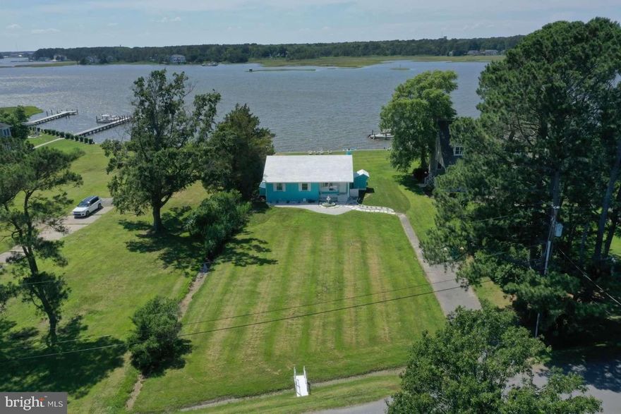 Sunset Serenity | A Refined Waterfront Retreat in West Ocean City, MD
Discover an exceptional waterfront residence nestled in one of West Ocean City’s most desirable and rarely available neighborhoods. Thoughtfully renovated from top to bottom, this modern coastal home offers direct water access, uninterrupted views, and breathtaking sunsets that define relaxed luxury living.

Offered fully furnished, the home features two spacious bedrooms and two full bathrooms, including a serene primary suite with an en-suite bath and direct water views. Clean lines, natural light, and curated finishes create a seamless blend of comfort and sophistication throughout.

The designer kitchen is both stylish and functional, complete with custom cabinetry, a built-in bar, wine cooler, and state-of-the-art appliances—perfect for entertaining or quiet evenings at home. A brand-new washer and dryer add everyday convenience.

Outdoor living is truly exceptional. The beautifully designed, furnished patio showcases elegant hardscaping, a hibachi-style grill, fire pit, and dining area—an ideal setting for sunset dinners, morning coffee, or waterfront activities such as crabbing, fishing, kayaking, and boating.

An additional 1,136 square feet of fully updated, usable attic space provides incredible flexibility and can easily be transformed into a private owner’s suite, guest retreat, or expansive storage area.

Additional features include a security system and two new storage sheds. The oversized lot offers future potential for expansion or an additional structure, should you desire.

With resort-style indoor and outdoor spaces, this home feels like a private coastal escape, yet world-class dining, shopping, marinas, golf, beaches, and nightlife are just minutes away.

A rare opportunity to own a sunset-filled waterfront sanctuary—where luxury meets laid-back coastal living.

Buyer’s agents welcome