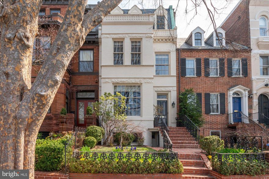 Welcome to this elegant Georgetown home, with direct, open views overlooking the Visitation field and sun-filled rooms across four levels and approximately 4,100sf (per the floor plan). The expansive living areas offer a flexible floor plan. 

On the main level, soaring ceilings a wood-burning fireplace compliment the double salon, large dining room and eat-in kitchen. The sunny kitchen offers a center island with seating and opens to the garden, with two terraced areas, ample room for dining and living areas.

The second level offers a spacious primary suite, compete with a seating area, two large walk-in closets, and a bath with separate long vanities, a soaking tub, steam shower and water closet.  The second bedroom on this also makes an ideal study or family room, with a wood-burning fireplace and direct views of the Visitation field. A hall powder room serves the first and second floors. Upstairs, there are two bedrooms and a full hall bath. The front bedroom doubles as an office, has a small balcony and overlooks the Visitation field. 

The lower level offers additional flexibility with a large family room (currently used as a gym) that includes a kitchenette, a “bedroom,” full bathroom and laundry room (with a separate dog bath/shower) plus extensive storage. With front and rear exterior access and a door that closes off the living area, the front of the house would work well as an au pair/in-law suite. 

The garden has been transformed with extensive hardscape and landscaping and there is an over-sized two car garage with a second floored storage area accessed by a connecting staircase.