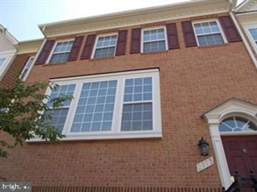 Stunning 3-level brick townhome, with 4 bdrms, 3 full baths and 1/2 bath. Main level has kitchen, living space with fireplace and French doors to deck. Gourmet kitchen with vaulted ceilings with plenty of additional space for gatherings. Hardwood floors finish off the main level.  Upper level has luxurious master bath with shower with 2 walk-in closets. Both washer and dryer on upper level for convenient laundry duties. This townhome is walking distance to metro station for ease of commuting. Close to restaurants and shopping.
