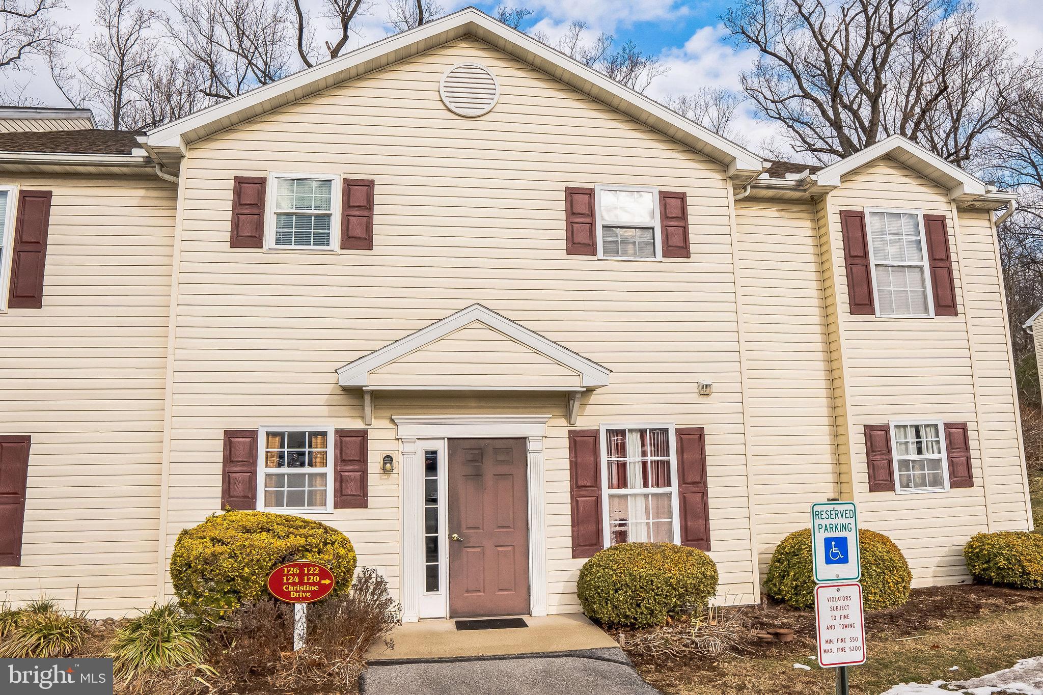 Welcome to 122 Christine Drive, a delightful 2-bedroom, 2-bathroom condo nestled in the highly sought-after Laurel Springs neighborhood of Reading. Upon entering, you'll immediately be greeted by a bright and spacious living room, complete with plush carpeting that enhances the cozy, inviting atmosphere. A sliding door off the living area opens to a private balcony, perfect for enjoying the outdoors. Adjacent to the living room, the kitchen is a true highlight, featuring sleek tile flooring, a convenient breakfast bar ideal for casual dining, and ample space for preparing meals and entertaining guests. The hallway leads to the primary bedroom, offering soft carpeting, a generous walk-in closet, and a private en-suite bathroom. The bathroom boasts tasteful tile flooring, a shower/tub combo, and a single vanity with plenty of space. The second bedroom, also carpeted for comfort, is ideally located near the second full bathroom, which includes tile floors, a tub/shower combo, and a single vanity. For added convenience, the condo includes a laundry room. This charming community offers a variety of amenities for residents to enjoy, including a clubhouse, playground, tennis courts, and a refreshing community pool—perfect for both relaxation and recreation. Don’t miss the chance to make this lovely condo your new home. Schedule a tour today!