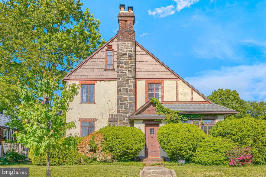 **Professional pics coming soon & should be active 5/14/26** One of Dundalk’s best-kept secrets, the charming enclave of Dunlogan is home to this stunning Tudor-style residence rich in character and timeless appeal. From the moment you arrive, you’ll be drawn to its storybook aesthetic—featuring an eye-catching roofline, classic stucco, detailed woodwork, and beautiful stone accents.

The fenced backyard offers a private retreat, complete with a spacious second-level balcony—perfect for a cozy wicker bistro set and morning coffee or evening relaxation.

Step inside and discover that the home’s exterior charm carries throughout the interior. Highlights include hardwood floors, transom windows, two wood-burning fireplaces, elegant trim, and antique doors that add warmth and authenticity. The main level offers generous living space, including a kitchen, living room, separate dining room, full bath, and a bright bonus sunroom.

Upstairs, you’ll find three well-sized bedrooms, a full bath, convenient laundry area, and access to the rear balcony. A secondary staircase along the side of the home provides additional access to the main level.

The attic is expansive and full of potential, while the finished basement features a cozy family room with a second fireplace—ideal as a fourth bedroom, guest space, or flex area. The basement also includes mechanical systems, storage, and a flush already in place for a potential additional full bath.

A detached two-car garage complements the home perfectly, matching the Tudor aesthetic.

Enjoy the opportunity to create your own garden oasis this spring in the lovely backyard. Ideally located just off Dundalk Avenue, this home offers easy access to major commuter routes including I-95, I-695, and I-895.

Don’t miss your chance to own a truly unique home in one of Dundalk’s most distinctive neighborhoods.