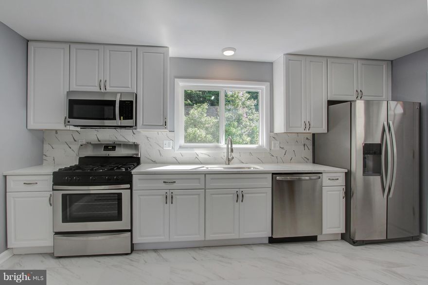 Amazing Home in a great Location!! Huge Carport and Driveway! Spacious Kitchen w  Eat In Space/Island, SS Appliances, Quartz Counter, Remodeled Bath, Front Loading Washer Dryer, Porcelain Tiled Basement Floor, New Windows...!! 4th Bedroom/ Den.