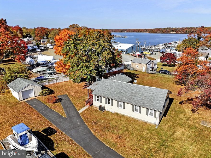 Welcome to 89 Farmdale Road—a beautifully renovated 3-bedroom, 3-bathroom rancher nestled in the sought-after Hacks Point community, just steps from the scenic Bohemia River. Recently updated in 2023, this 1,748 sq. ft. home blends modern conveniences with classic charm, now featuring two en-suite bathrooms for added comfort and privacy.

Step inside to a spacious living room with a striking vaulted wood ceiling, a cozy propane stove, and sliders leading to a bright Florida room, perfect for soaking in peaceful views of the community’s riverside landscape. The upgraded eat-in kitchen boasts modern appliances and generous storage, while the large formal dining room offers a welcoming space for gatherings. Thoughtfully designed with plenty of natural light, each room adds to the home’s open and inviting feel.

Outside, you’ll find an oversized detached garage with electric, providing ample storage for boating equipment, beach gear, and more. Set on 0.505 acres across two tax parcels, the property offers ample space to unwind and enjoy the river-oriented lifestyle. With marinas, sandy beaches, and Chesapeake City’s quaint shops and dining nearby, 89 Farmdale Road is the perfect retreat for a seasonal getaway or a full-time residence.

Experience a peaceful, community-centered lifestyle close to the Bohemia River—welcome home!