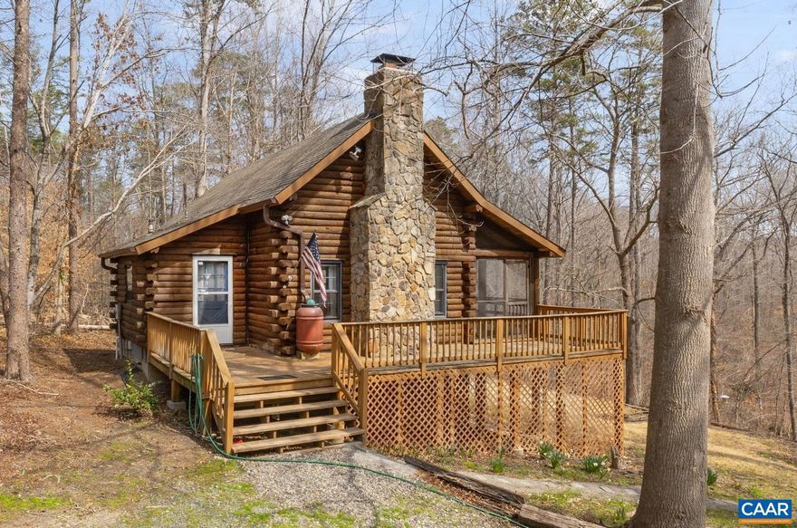 This adorable log home is waiting to be your private paradise. You?ll love the gorgeous logs, the beautiful stone fireplace, and the overall charm of the home.  There is a main level bedroom w/attached half bath plus a large bedroom in the loft.  There is another bedroom in the basement, plus another half bath, already prepped to add a shower. Also an office (there is firefly fiber for internet, so work from home is easy!). The screened in porch takes in the sights and sounds of nature and the ample deck on the front extends outdoor living, plus giving you a view of the creek down below!  A large detached garage provides extra storage both on the main level and in the storage area up above. Please note that all SqFt referenced are estimates. Easy access to Richmond and C'ville, close to Zion Crossroads, these drives are all easy! Want to get away from the rat race? This home is a must see!