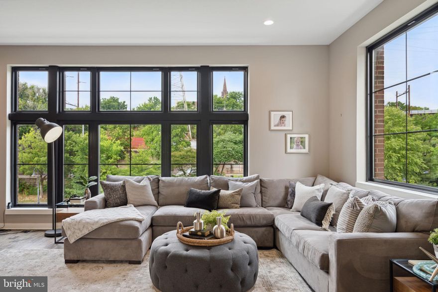 Stunning 3 yr young end unit Luxury Townhome  in The Locks in Manayunk is set beautifully within the community, allowing for  water views on all sides and an abundance of light and privacy!   This spectacular 4 bedroom 3.5 bath sun drenched home includes a two-car garage, a 5-stop elevator, luxurious finishes,  thoughtful design, gorgeous water view vistas, a fantastic roof deck, is ready to move right in and is in an amazing "walk-to" location in the heart of Manayunk. This Extra Wide Floor Plan (23ft wide) and coveted end unit position offers corner floor -to- ceiling windows that flood the space with natural light and unobstructed panoramic water views from the front and back.  Plus a 10-YEAR TAX ABATEMENT with 7 yrs remaining!  

Enter this stunning home and the expansive open floor plan, show-stopping kitchen, high ceilings, large modern black framed windows, and hand-scraped hardwood flooring draws you in.  The perfect layout for entertaining and peaceful everyday living!  The designer kitchen is anchored by an expansive island that offers ample seating and generous counter space.  Stainless steel top-of-the-line appliances, custom cabinetry, designer tile backsplash and quartz countertops make for a stunning visual while a gas 6 burner Wolf range & oven, extensive counter space and a Sub Zero make this kitchen highly functional, not just beautiful! The breakfast room has a built-in dry bar with beverage fridge and extra countertop space and cabinet storage. The large dining area can accommodate a generous table and offers a flexible space for an expanded gathering.  The family room is light and bright with a corner wall of windows and water views, catch glimpses of turtles sun bathing and ducks frolicking in the water below. 

Upstairs the Primary Suite encompasses the entire fourth floor and includes a balcony,  3 walk-in closets, a sitting room/nursery/office and a spa-like bath with a double vanity, quartz counters, large frameless glass shower with bench seat and rain shower head, and a soaking tub.  The third floor has three spacious bedrooms. Bedroom #2 is an en-suite with its own luxurious bath including a glass framed shower and a spacious closet. The two additional bedrooms each have large outfitted closets and share the hall bath with double vanity and white tiled tub/shower combination! The large laundry room with ample storage and tiled floor is also located on this level.  The upper level provides access to the amazing roof deck with incredible views of Philadelphia, the Schuylkill river and Manayunk! The Garage entrance conveniently opens to a finished space with tiled entry making a great library or home office/gym.   A coat closet and additional storage finish this level! The elevator is a fabulous convenience and runs from the garage level to the roof deck making outdoor entertaining easy!  A 2 car garage with additional storage and EV charger completes this fabulous home!  All of this is located steps to main street Manayunk, coffee shops, restaurants, retail, train and the bike trail that extends into Philadelphia, Malvern & beyond! The Locks community has plenty of guest parking and is convenient to all highways, downtown and the suburbs!