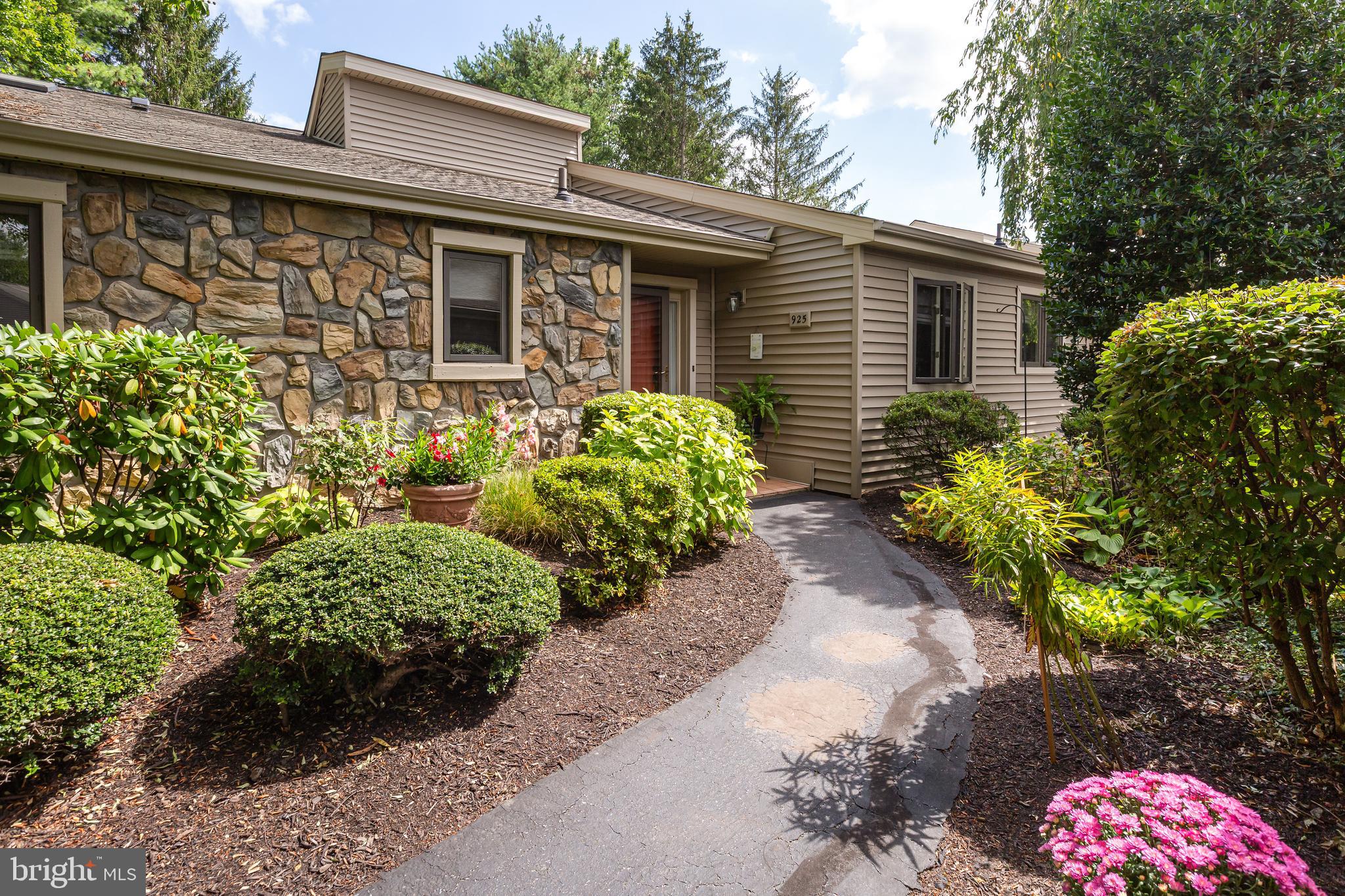 Welcome to 925 Jefferson Way, a thoughtfully designed Bradford model in the highly sought-after Hershey’s Mill 55+ community! This 2-bedroom, 3-bathroom home with a bonus den is the perfect “right-sizer” option for those looking for a more manageable lifestyle without sacrificing convenience and style! Ideally located in Jefferson Village mere steps from the community’s phenomenal amenities, including tennis and pickleball courts, the swimming pool, and the community center, at 925 Jefferson you’ll find yourself right in the heart of Hershey’s Mill.
As you step inside, you’ll immediately notice the home’s bright and inviting atmosphere, thanks to the five brand-new skylights that flood the space with natural light. The open floorplan creates an airy feel, with easy transitions between each space. The kitchen features ample counter and cabinet space, and a comfortable breakfast nook for casual dining. In the living room, french doors open to a bonus room, currently used as a home office with endless potential for customization. The finished basement offers plenty of additional living space with room for recreation, a bonus room for hobbies, a home office, or gym, and an attached full bathroom. The Florida room, boasting a high ceiling and views of the lush backdrop, is a comfortable place to relax with a cup of coffee in the mornings, while afternoons and evenings are best spent grilling on your private patio!
Nestled by the boroughs of West Chester and Malvern, Hershey’s Mill provides a location close to the Main Line while still maintaining the atmosphere of a private, close-knit community. With the Malvern train station nearby, commuting into Center City Philadelphia is a breeze. Experience peaceful living with amenities that include a Community Center, library, pool, tennis courts, pickleball, wood shop, walking trails, and, of course, the nearby golf course and clubhouse. A golf club membership is available for an additional fee and a one year social membership is complementary for new residents of Hershey’s Mill: enjoy happy hours and get to know your neighbors!