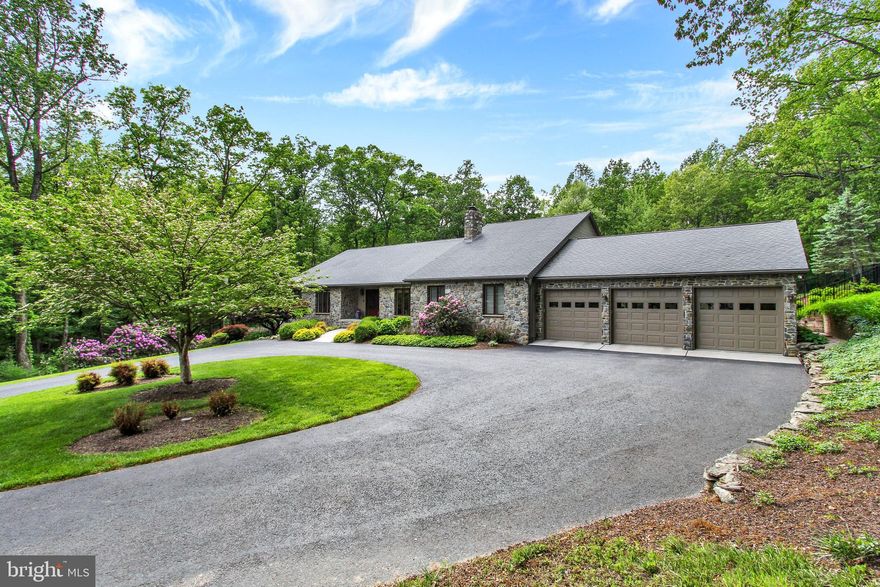 11.8 Acres in a Private Setting with over 6,000 sq ft to enjoy with friends and family.  This property is presently in Clean and Green featuring a lovely pond, fenced inground pool, storage shed and lovely ranch style home with a three car garage.  An added special feature includes a separate entrance with an in-law-quarters on the lower level which is at ground level and has windows to let the light in and take advantage of the wonderful view of the trees.  You pull up  the driveway to see a pond on the left and continue about the circular driveway to the front door.  Stone steps lead to the large foyer with white oak wood flooring which opens to the great room.   Cathedral ceiling, sky light and an open floor plan to the large dining area.  Beautiful view from every window.  Look to the right which is a view of the large den with stone wall and stone wood burning fireplace.  Crown molding, pocket doors to close off the door for privacy.  Next you will find the magnificent updated kitchen, with all the bells and whistles of a kitchen you have dreamed about.  High end appliances, self-closing doors and drawers.  Thermador gas stove, and refrigerator freezer, no hands needed to open and close.  Quartz counter tops, marble back splash, granite sinks, under counter lighting and baseboard lighting to name a few of the added special items that this unique kitchen encompasses. Steps from the kitchen there is a large walk-in laundry room with built-ins, laundry tub with quartz counter and hanging rack.  Large pantry with two oversized double closets with two extra refrigerator freezers which stay with the property.   Come see this beautiful property you won't be disappointed!