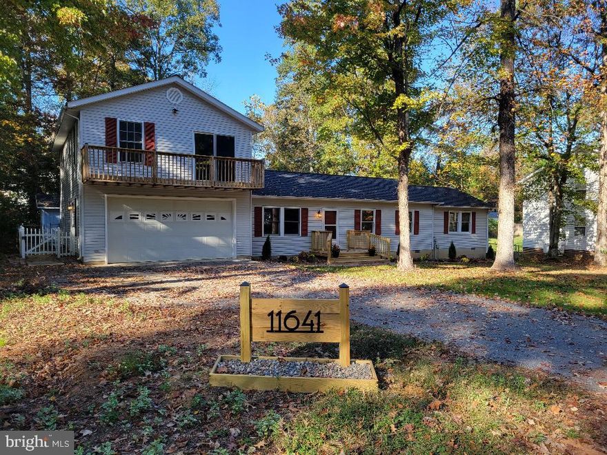 Massive 4 bedroom/3 full-size bathroom home--all new inside and ready to move in today.  Office, Den, and Game Room!  Large open concept kitchen one-of-a-kind custom tile design, island breakfast area, with all new appliances.  Waterproof luxury flooring and new carpet throughout. Large family room with walkout to rear deck.  Master bath spa-like suite including large soaking tub and oversized walk-in rain/hand shower. Large walk-in closet with custom shelving. New hall bathroom with unique tile, oversize walk-in rain/hand shower, and new vanity. Washer/Dryer included on main floor. Finished 2-car garage with beautiful epoxy floor opening to oversized flat asphalt driveway great for your boat or RV. Energy efficient with two heat pumps, 5 ceiling fans, and two whole house fans. Brand new roof in 2023. Welcoming front walkway deck and entrance along manicured landscaping. Large front and back yard on unique flat lot in CRE.  Oversized rear deck, cable railing, and deck lights, with grassy fenced back yard. Mature trees surround the yard. A few miles to shopping and great restaurants.  PAX River NAS - 6 miles.  Dahlgren - 32 miles. Too many extras to list. Must see property! 
Approx Room Sizes:
Master BR 13x18
Master Bath 13x8
BR2 11x14
BR3 8x12
BR4 12x8
Game Room/BR5 22x10 
Office/BR6 12x10
Den/BR7 20x11
Family Room 22x12
Living Room 15x18
Kitchen 6x20