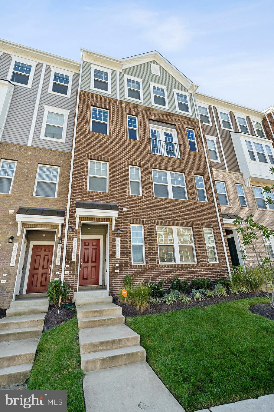 Exquisite, modern, 2 Bd w/bonus room /2.5 Bth 2-level Townhome! This contemporary home features hardwood floors throughout the main level and an open-concept layout that's perfect for entertaining. The sleek kitchen is a chef’s dream, featuring gorgeous quartz countertops, stainless steel appliances, and ample cabinetry for storage. Spacious living room boasts a cozy fireplace and expansive windows that flood the space with natural light. The upper level includes generously sized, carpeted bedrooms and beautifully designed bathrooms with double vanities, large mirrors, and built-in storage. Steps away from the community pool, clubhouse, and a massive Central Park, perfect for relaxation and outdoor activities. Just minutes from the metro, shopping, and a variety of dining options. Garage parking. Sorry no pets. Don't miss this lovely home! Application Fee: $60/person