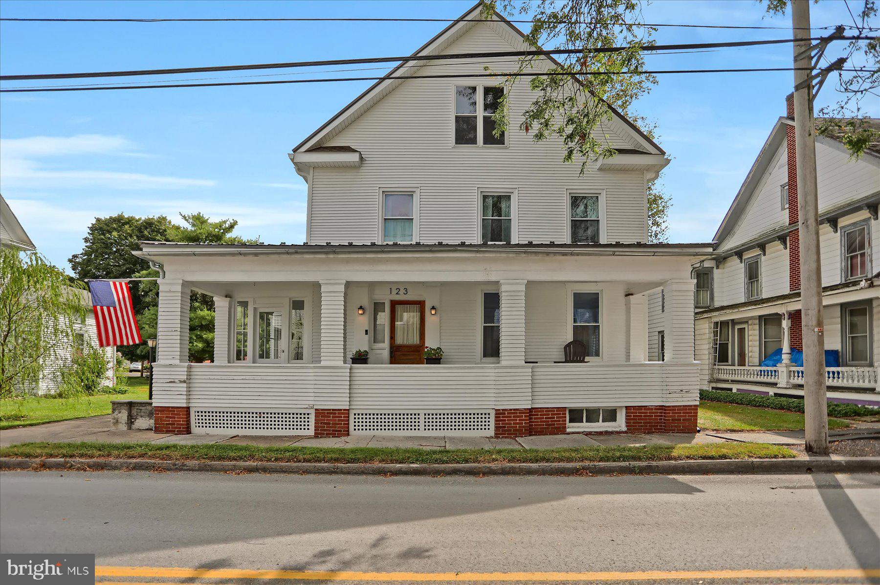 This home is best of both worlds with the character and charm of a historic home with modern, move-in-ready efficiency, and style. Starting with central air throughout, with two HVAC units zoning each floor separately, and updated wiring for today’s needs. On the outside, this home boasts beautifully restored porches & columns, a new metal roof, new soffit, facia, and gutters with leaf guards; while the windows and siding are only a few years old. This home also sits on a double lot with water access to Elk Creek! All that and we haven’t even talked about the inside yet! The main floor of this home has a newer gourmet kitchen with granite & butcher block countertops, island, stainless steel appliances, tile backsplash, accent lighting and open shelves. Adjacent is an oversized dining room perfect for large gatherings that flow into a big family room, making this entire area great for entertaining. Also on this floor is a laundry room with convenient utility sink and full bathroom with tile floor for guests. On the 2nd floor you’ll love the rustic hardwood flooring and large bedrooms with great closet space. Another full bathroom with new custom cabinetry and tile flooring will meet all your needs. But it doesn’t stop there, head to the 3rd floor that has high ceilings which means this space could easily be finished as a primary suite with 3rd bathroom, workout studio, or hobby space. The charm & detail in this home has to be seen in person, so schedule your showing now! Also, this home is located just a few blocks from downtown Millheim, so you can enjoy all the local restaurants, brewery, winery, coffee shops, shopping and more! Photos coming soon & showings start this Friday!