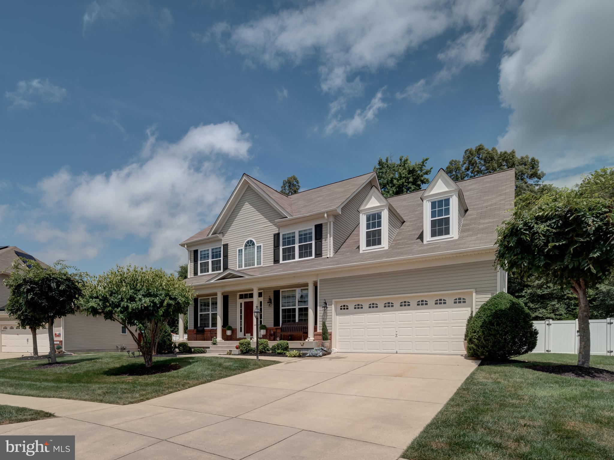 Move right into this huge, beautiful Colonial offering 4 bedrooms, 2.5 bathrooms, primary bathroom with separate shower and soaking tub, laundry in the upstairs level, wood floors on main level, den, fireplace equipped family room, maintenance free deck, 2 car garage, front porch, huge, fenced yard and much more! The basement is ready for your finishings! Thanks for showing!