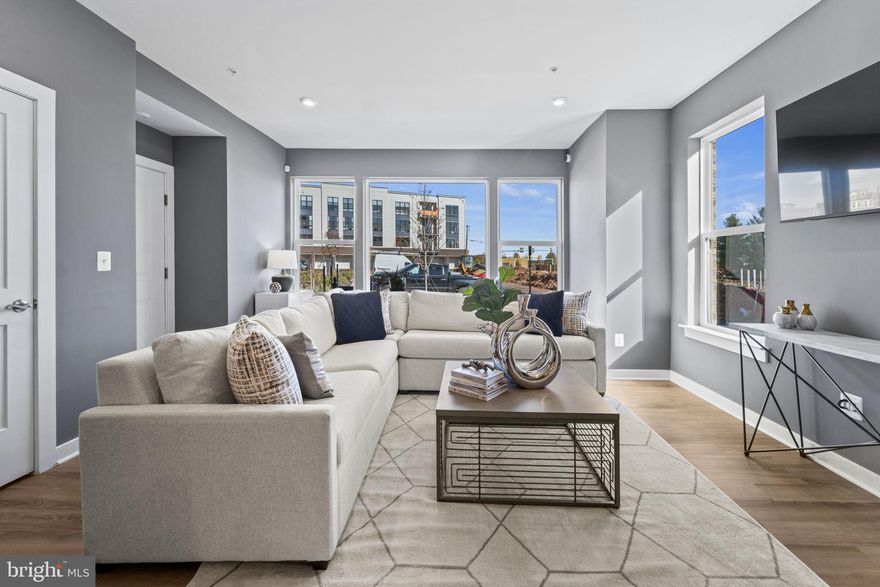 The open-concept design of The Tessa allows for ease of living and entertaining from the kitchen to the main family room whether that means a casual dinner on the couch or hosting happy hour with friends. The front of the condo has three large windows allowing for natural light to flood the space, making it feel even more spacious and open.

The family room is large enough for a 5-8 person sectional and is connected to the dining space and kitchen. For a 3-bedroom condo, the kitchen is built to impress. The quartz countertop peninsula provides seating for 5 and plenty of space to lay out meals.

The oversized primary suite on the second floor is big enough to make you feel like you’re in a single-family home. It has an en-suite bathroom, double vanities, two walk-in closets, and a private water closet. Two other bedrooms with a full hall bathroom is perfect for out-of-town guests or a work-from-home space!

Photos shown are from a similar Tessa floorplan.