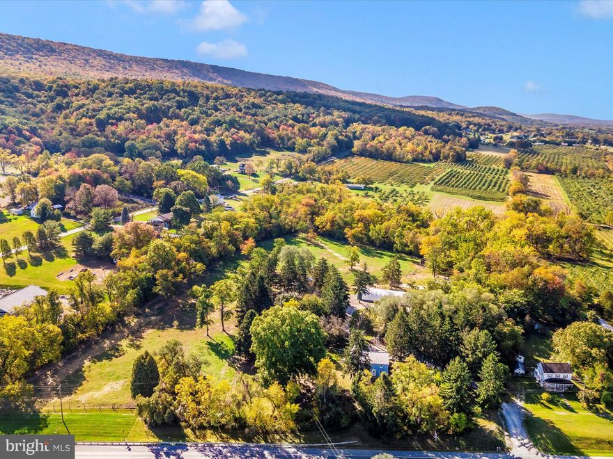 Let your imagination soar with the possibilities for this special property.  Currently well positioned for continued use as a farmette or consider other agricultural uses (garden, fruit trees, party barn) or convert back to a kennel operation which was its previous use.  The almost 13 acres  is organized into multiple paddocks for livestock large and small.  Several outbuildings including a Coverall style ( @ 30' X 85" X 15')  with a NEW cover, 125' X 16' building that was formerly a kennel and could easily convert back.  Currently used for goats, sheep+.  Additional outbuildings include run in sheds.  

The home is comfortable and allows for expansion if needed.  Additional accessory building next door to home has a kitchenette and full bath.  Easy AirBNB, office  or use your imagination!